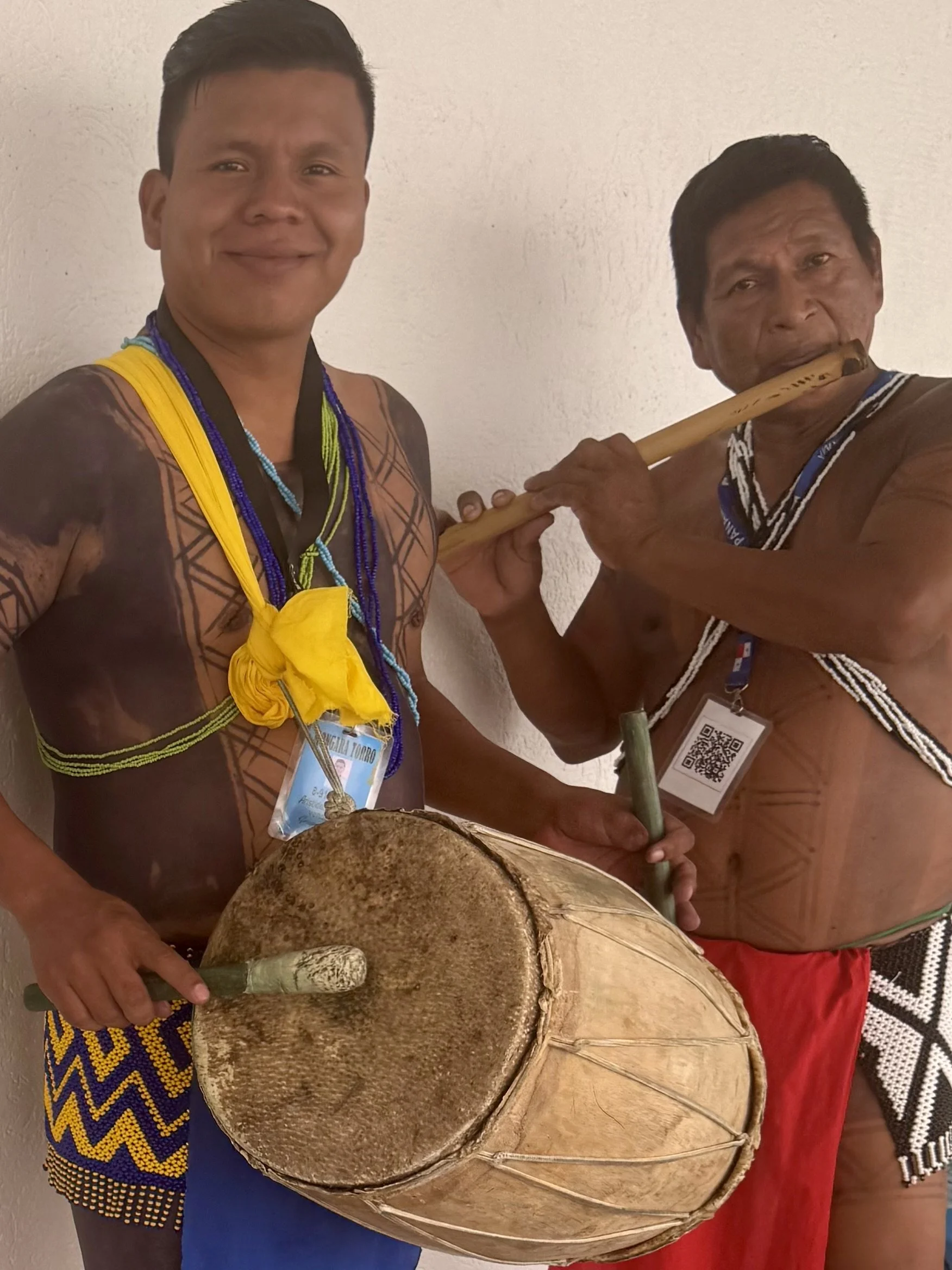 Indigenous Guna musicians playing traditional instruments in Colon, Panama.