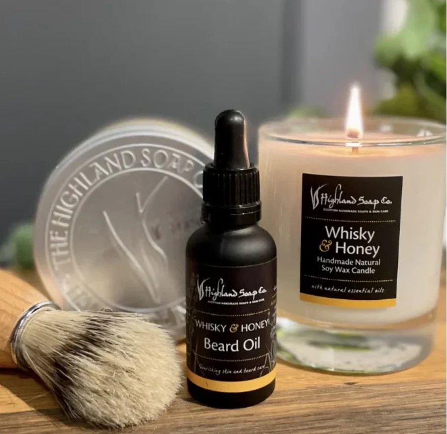 Handmade soap, beard oil, and wax candle in Ireland marketplace.