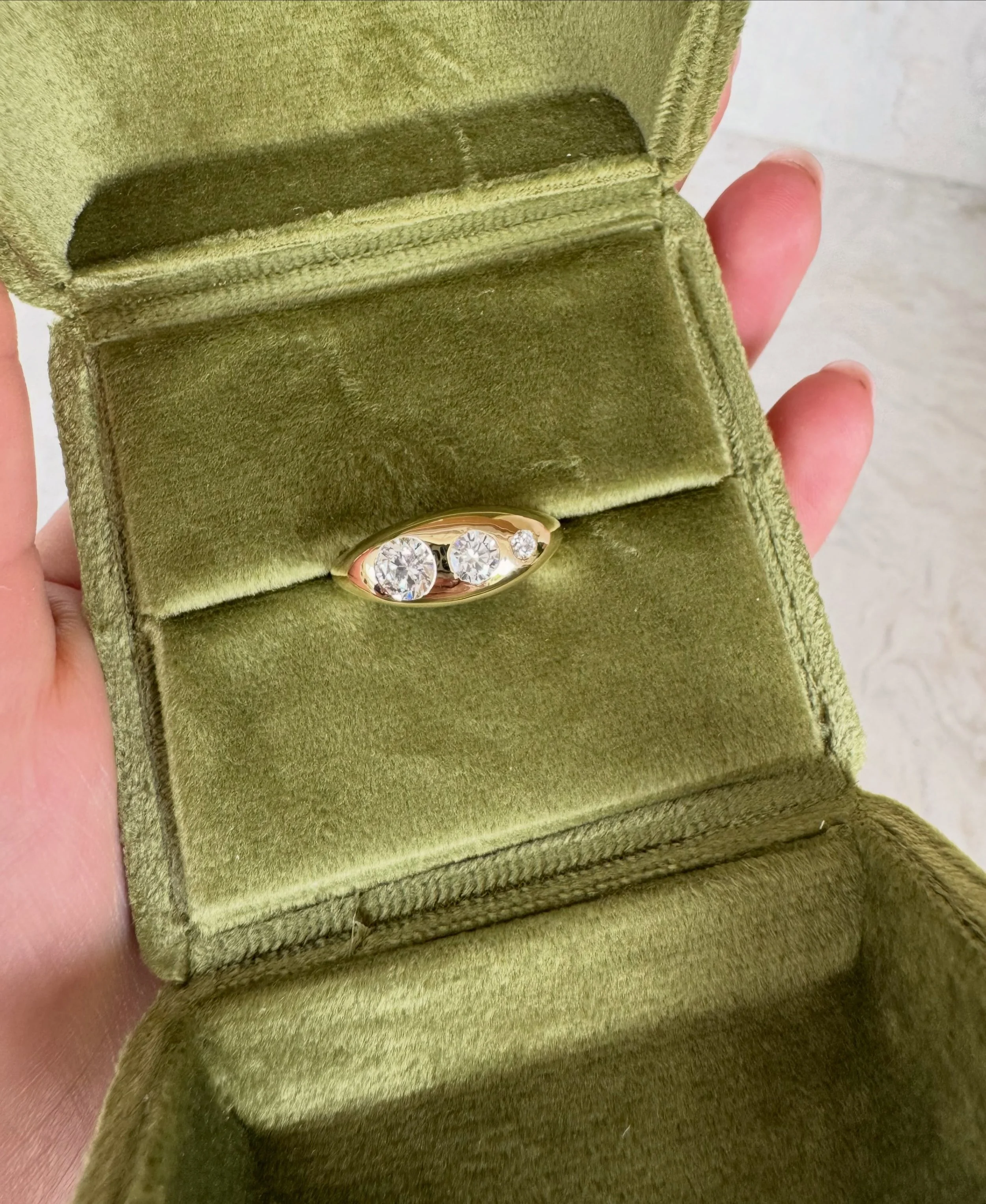 I had so much fun creating this ring with my brother-in-law as a surprise gift for his wife to celebrate the birth of their son.

The three diamonds represent the three members of their family. I love creating jewellery like this, so sentimental and 