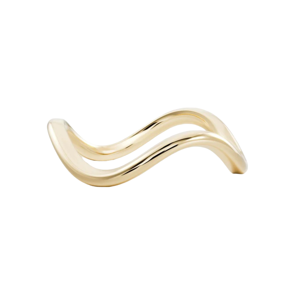 Gold curved jewelry piece in a wavy design
