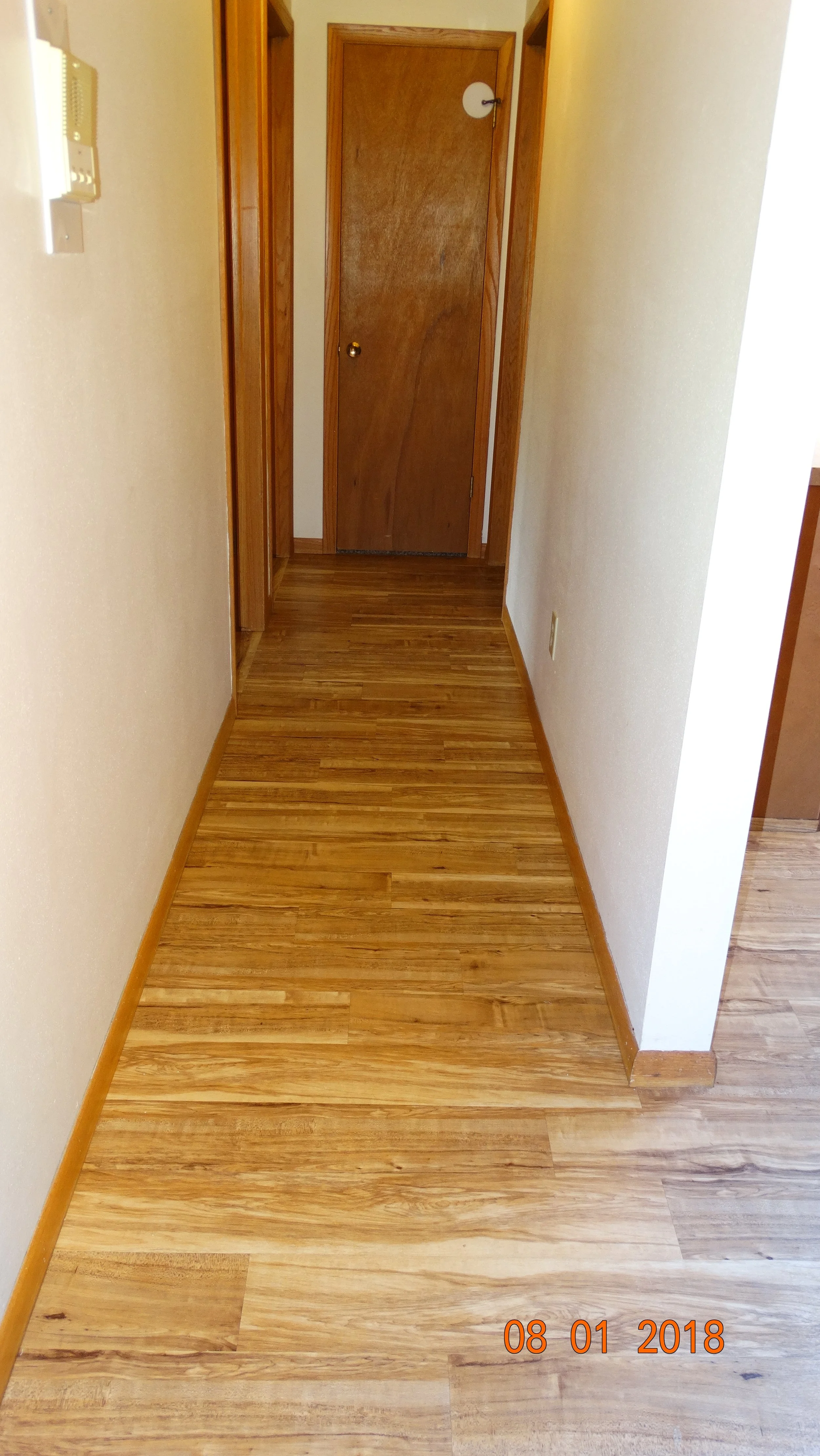 Hardwood floor hallway 2-bedroom apartment at Hartwell Place Apartments in Waukesha #307