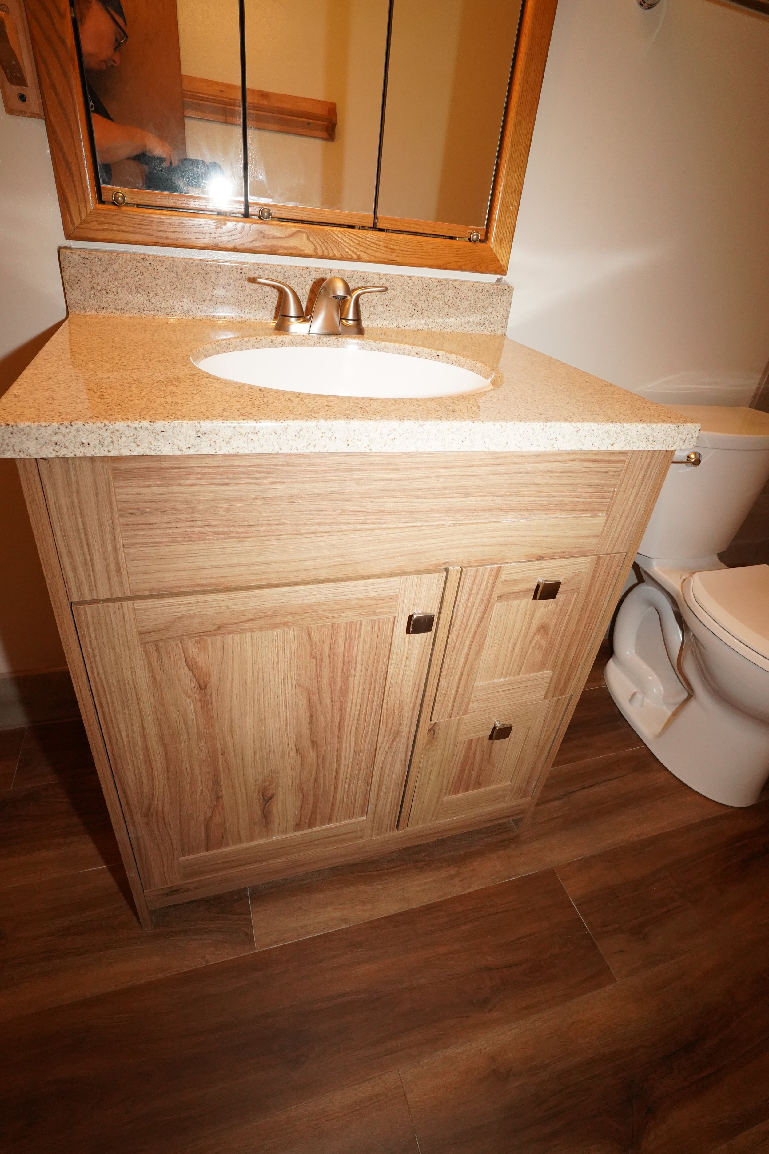 Hartwell Place Apartments | Waukesha, WI | Beautiful updated wood bathroom vanity