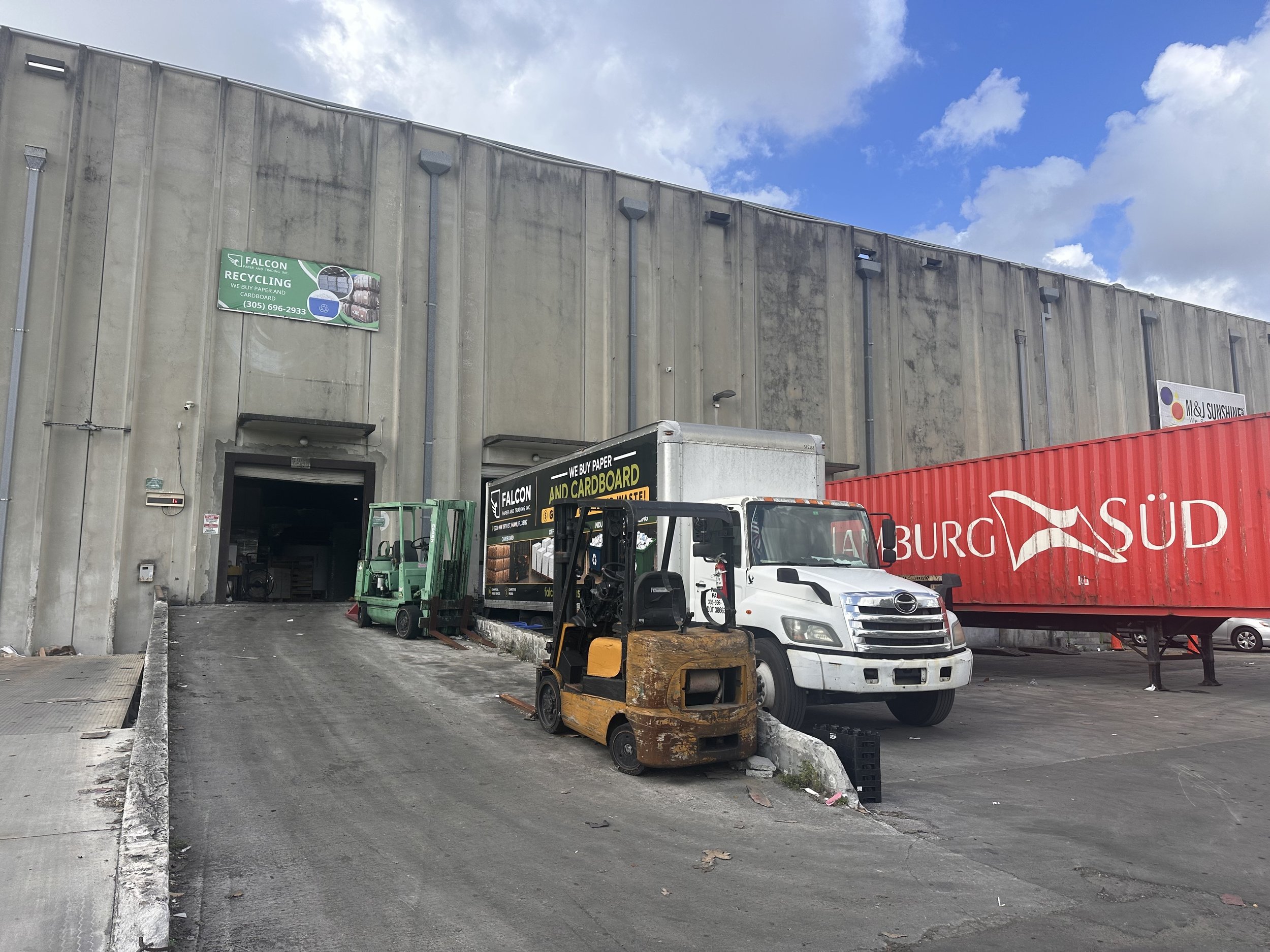 Falcon Paper's warehouse and truck at the loading area.