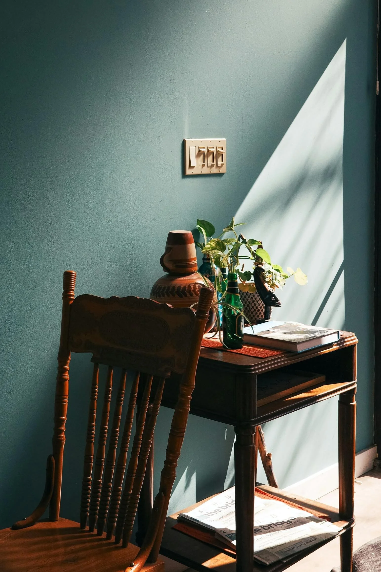 therapy office chair with table behind it, plants