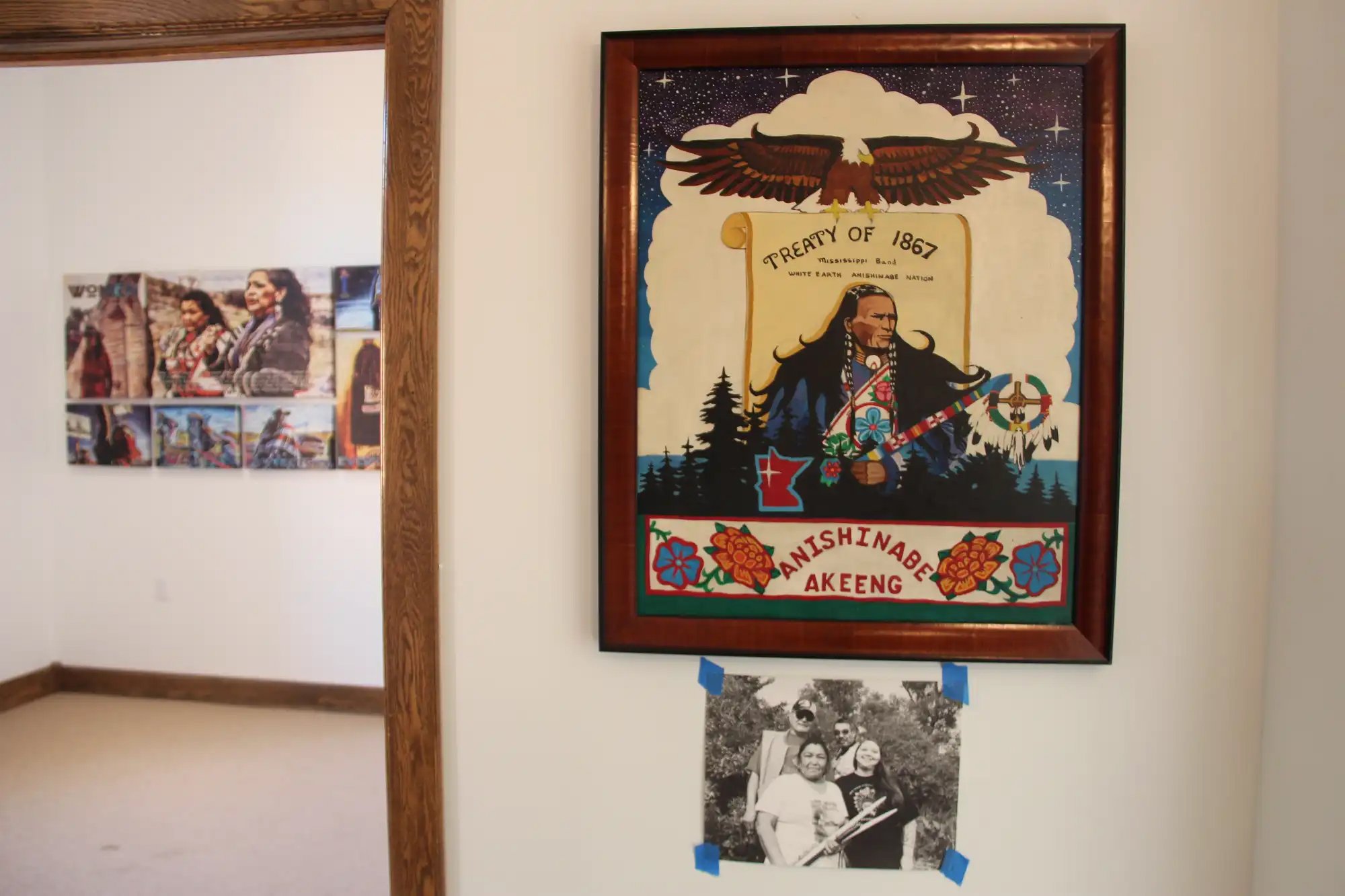  The museum weeks before opening. A painting from Winona LaDuke's private collection, and a view into the water protector exhibition featuring a photo by museum curator Sarah (Miskwaa-ens Migiziwigwan) Kalmanson.  Alex V. Cipolle | MPR News 