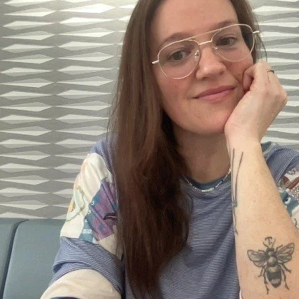 A happy client of Jenn Menzer's fitness program giving a testimonial for womens personal training