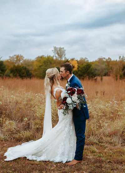 Wedding couple celebrating at Troyer’s Prairie Gold in Garnett, Kansas