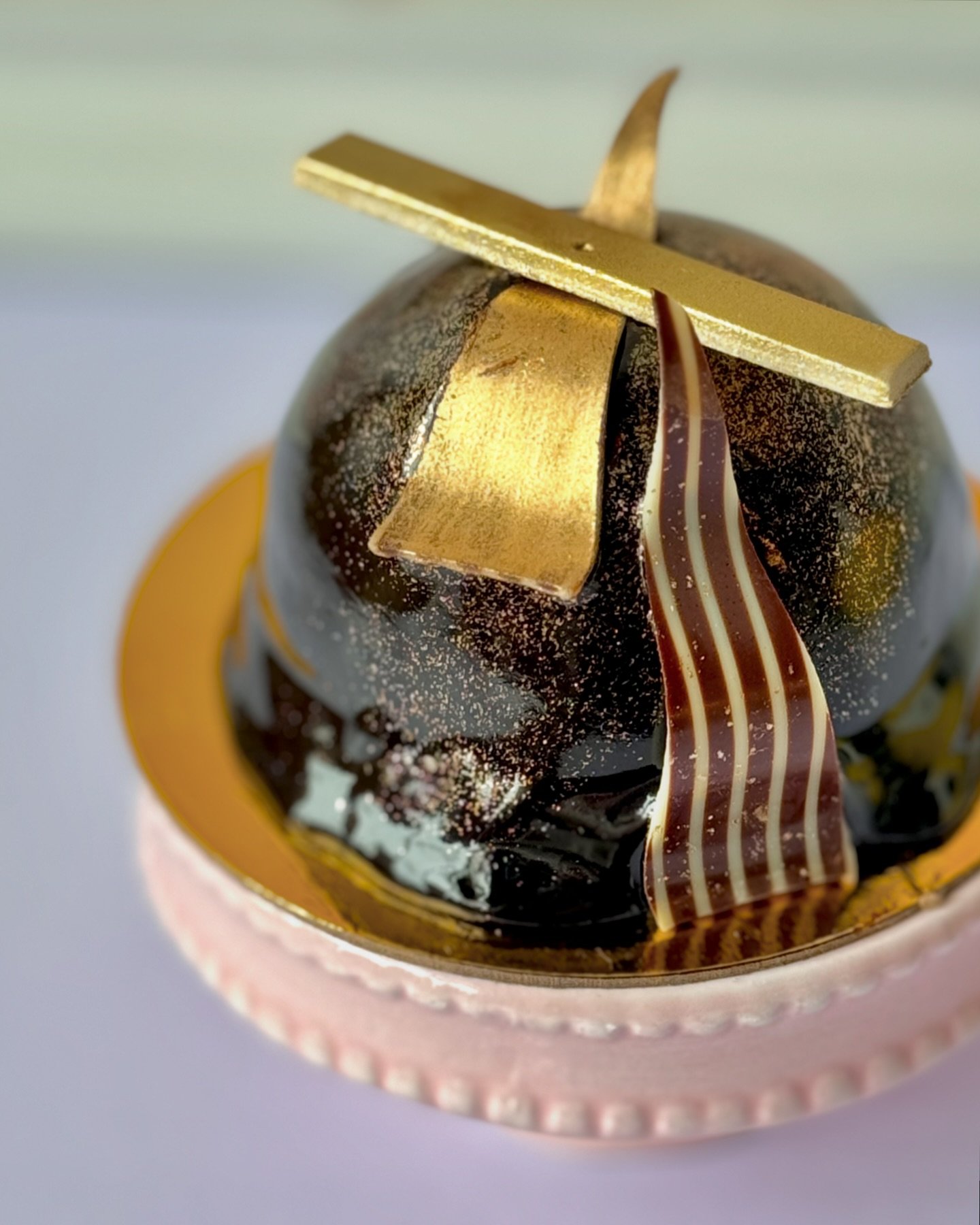 Give mom a chance to indulge this Mother&rsquo;s Day with one of our chocolate bombs🤤🍫

A chocolate flourless cake atop a rich chocolate crust, filled with salted caramel and caramel cup candies, covered in a decadent mirror glaze and finished with