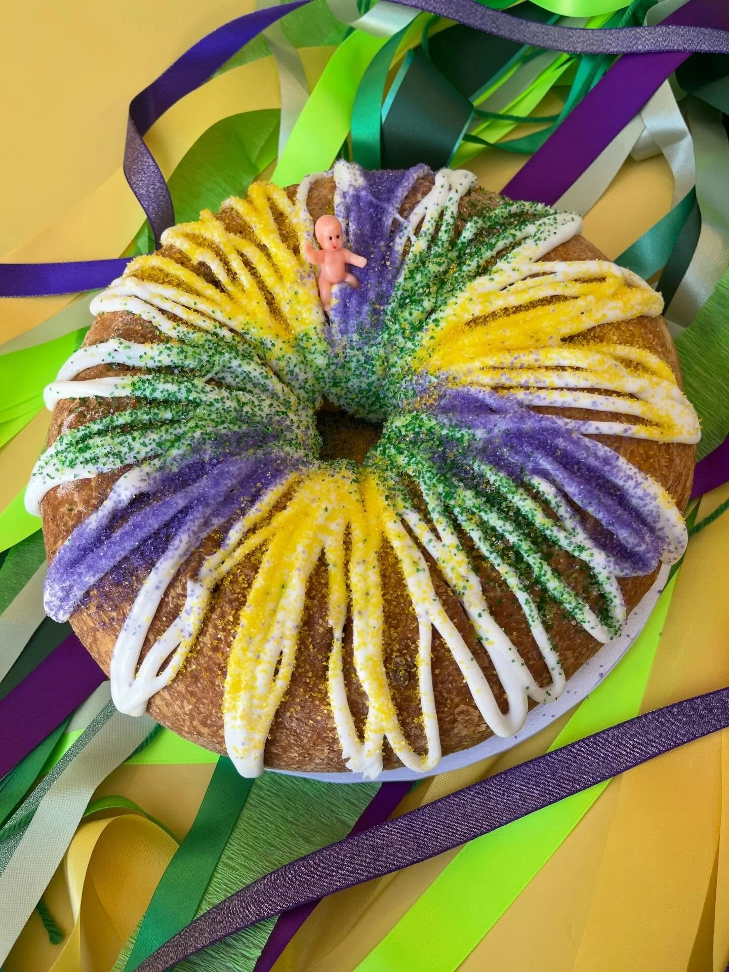 King cake season is officially in full swing 👑

Pre-order now to pick up Feb. 13, 14, or 17 💚💛💜

📧 info@wildflourbakery.com
📞 440-331-2950