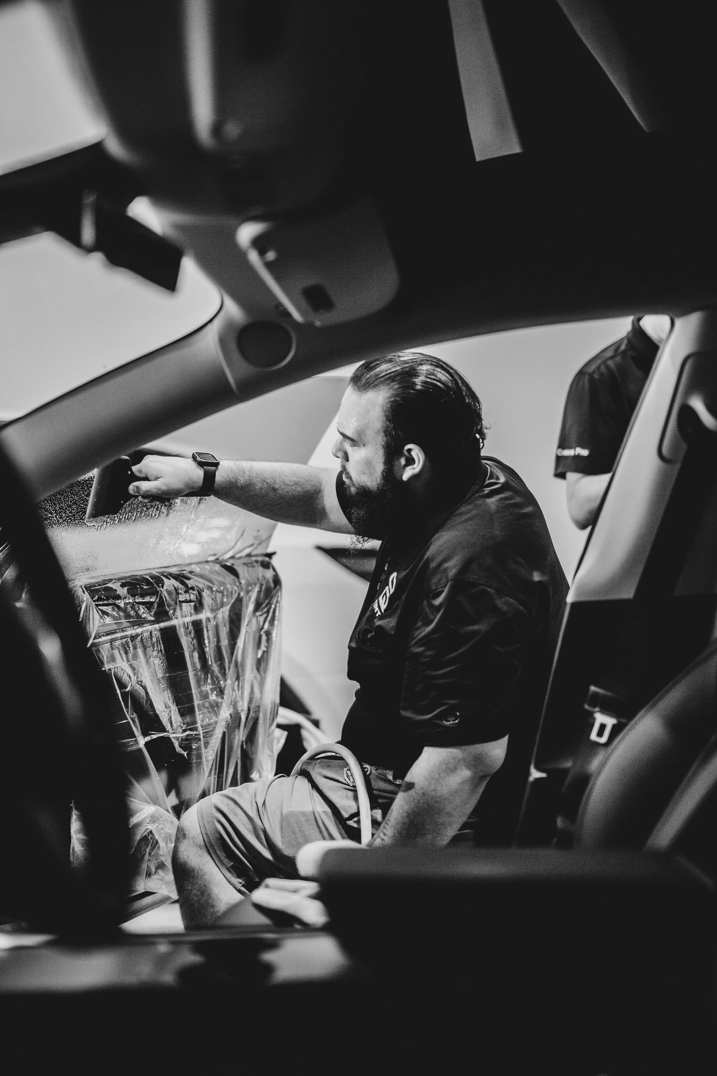 installing window tint with squeege