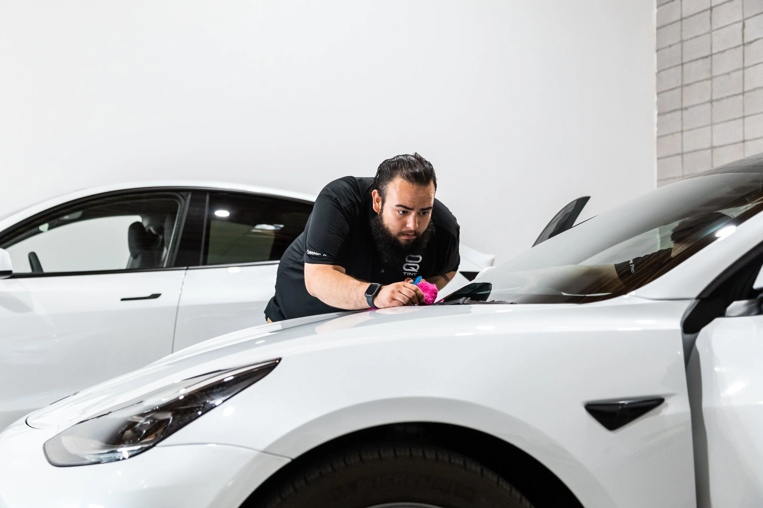 Window tinter detailing front windshield  ceramic tint.