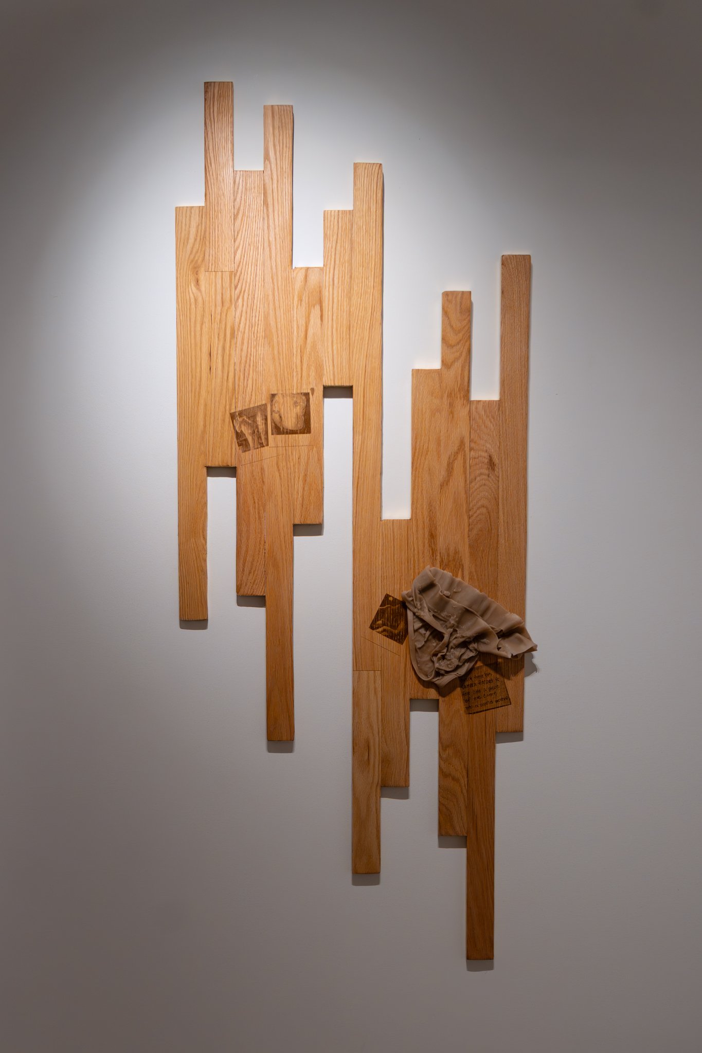 𝘳𝘶𝘥𝘺 – 𝘫𝘶𝘭𝘺 12, 2025.  2026. red oak hardwood, screen printed wood stain, metal leaf, cast wax. 68"H x 27"W.