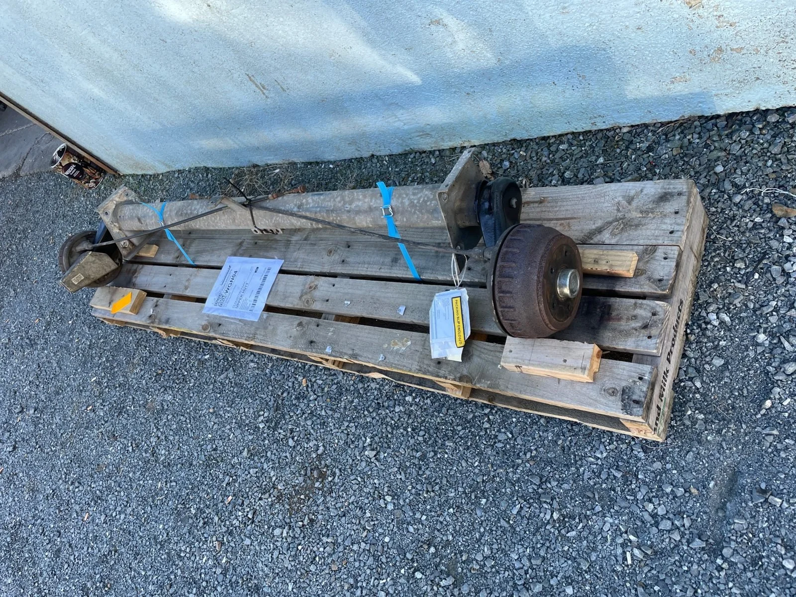 Caravan axle removed and packed for freight to the re-rubbering specialist