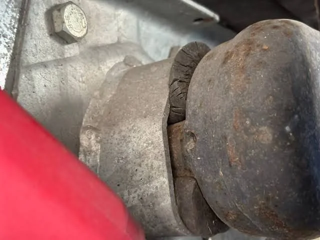 Perished Duratorque rubber sticking out of a UK caravan axle