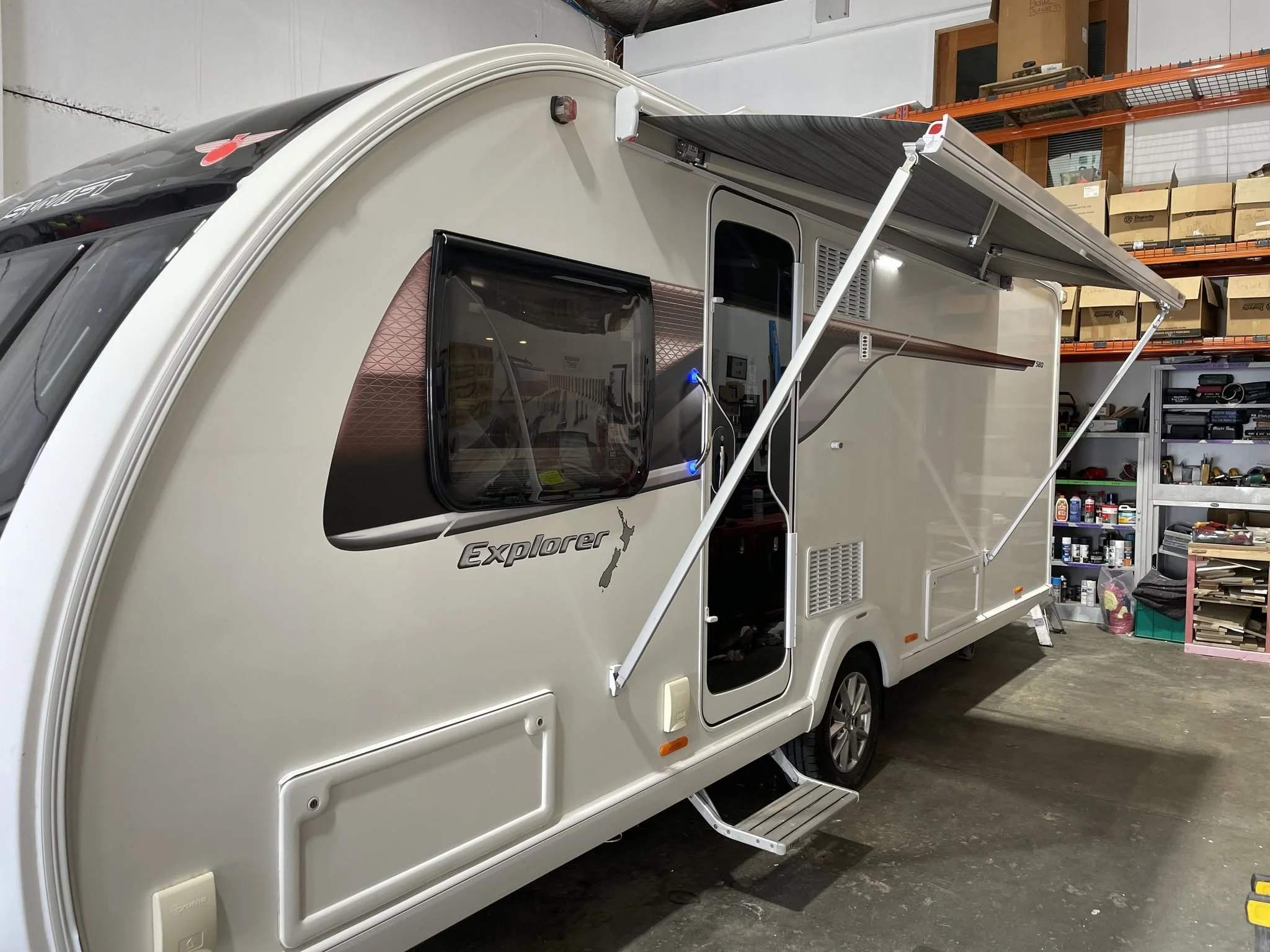 Wind-out awning fitted to a Swift caravan at the RV Dreams workshop in Upper Hutt