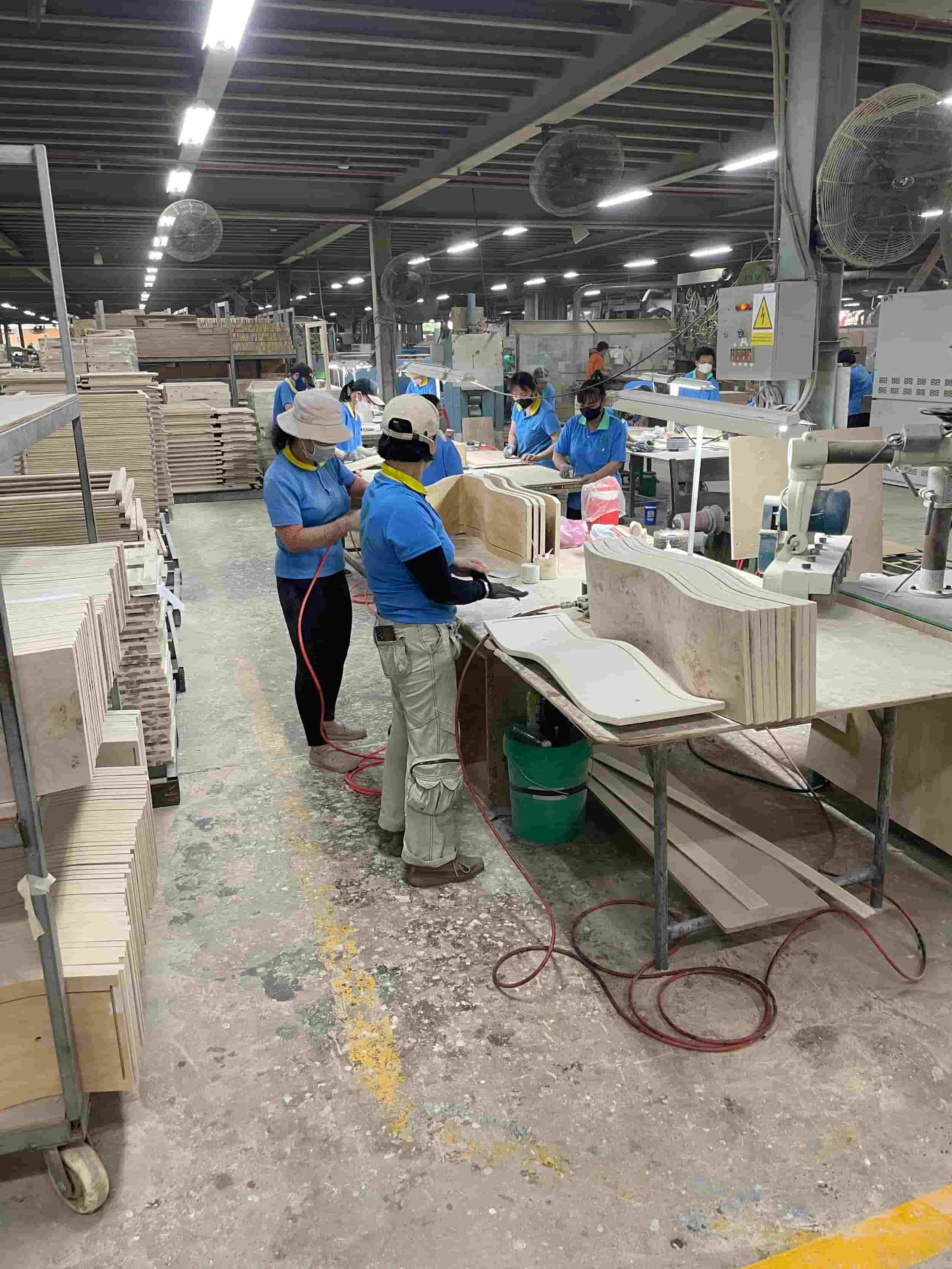 Workers in furniture factory