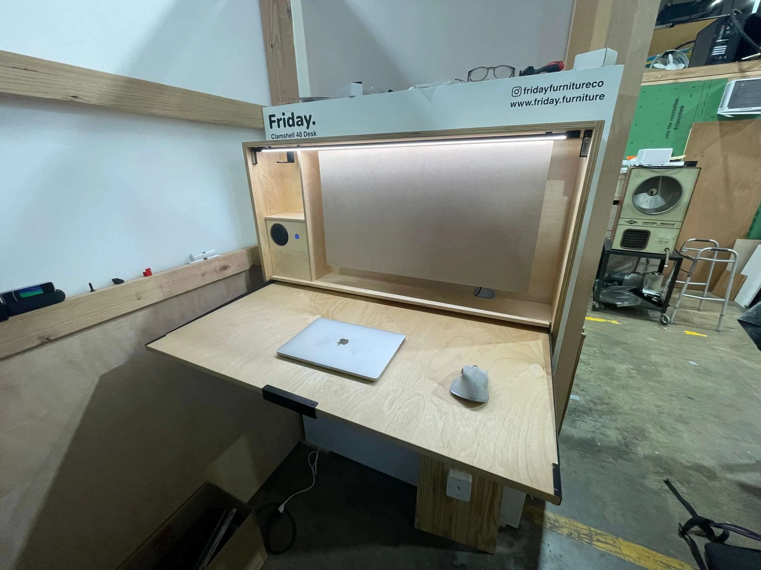 Razorclam murphy desk installed on wall in workshop