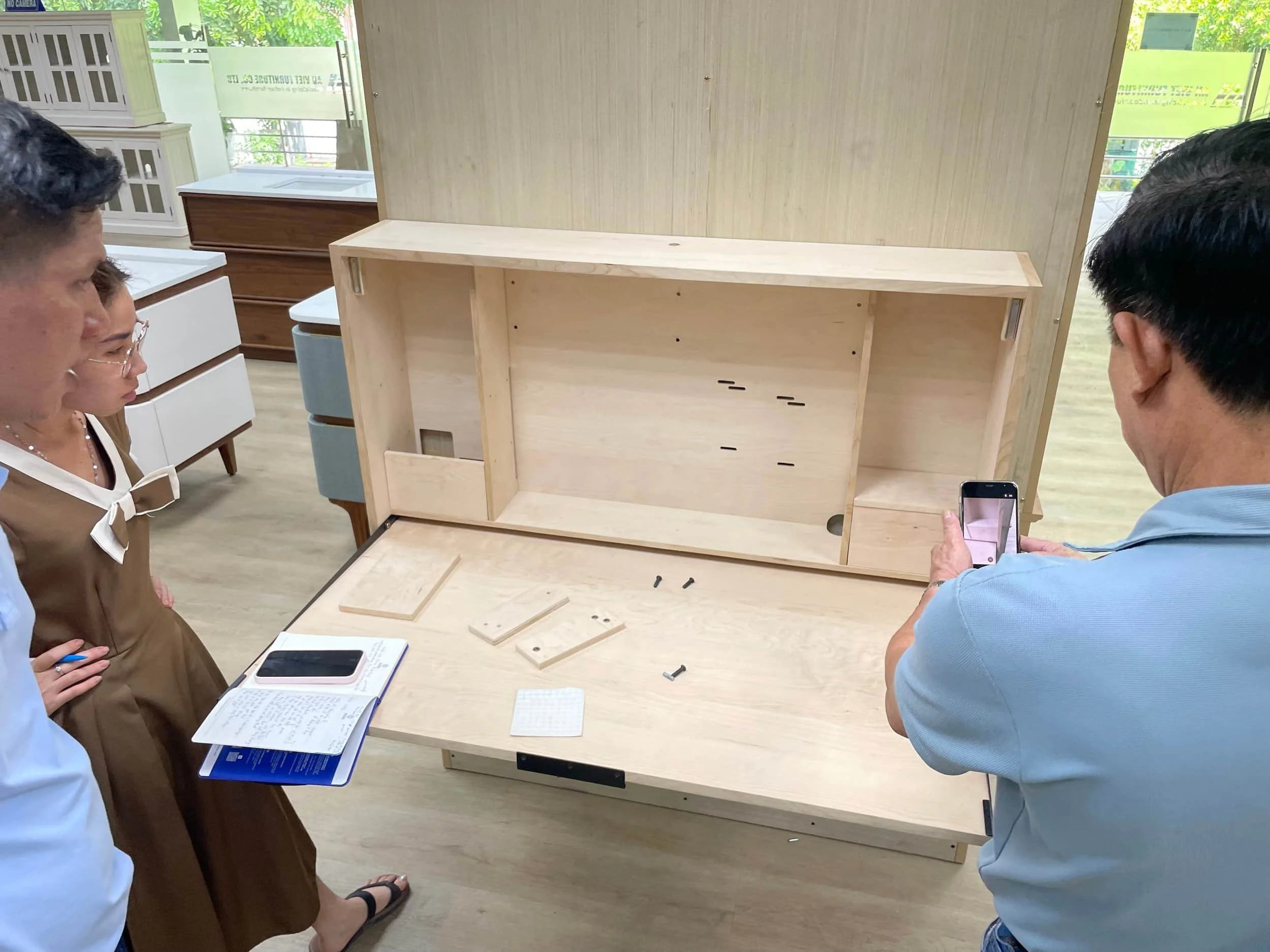 Factory workers inspect Razorclam Murphy Desk
