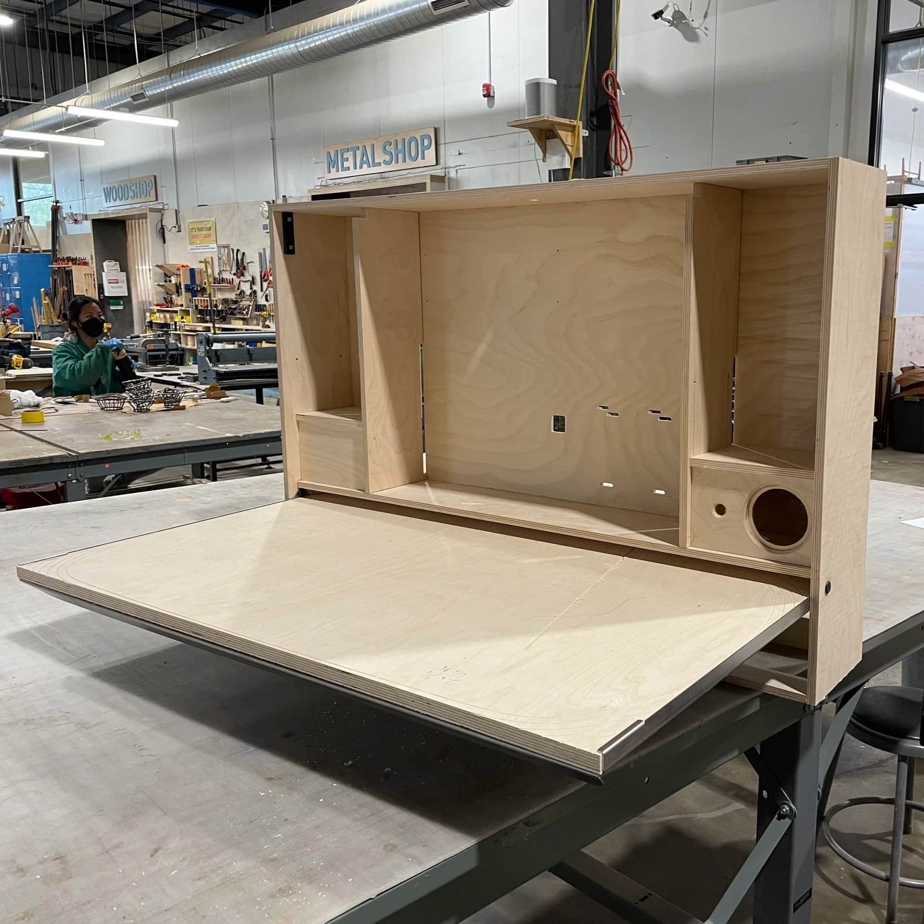 Prototype of Razorclam Murphy desk open on workbench