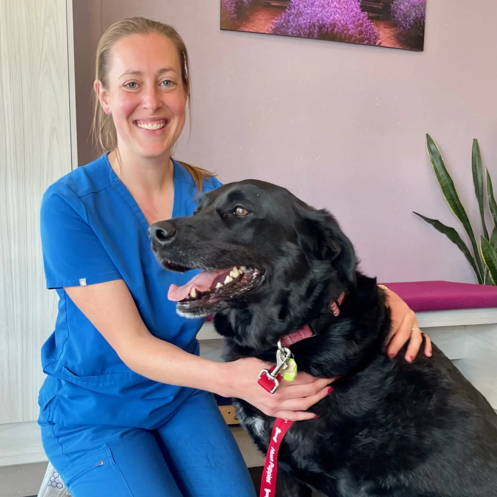 Astrid, the Senior Associate Physiotherapist, at The Dog Wellness Centre, pictured with her dog
