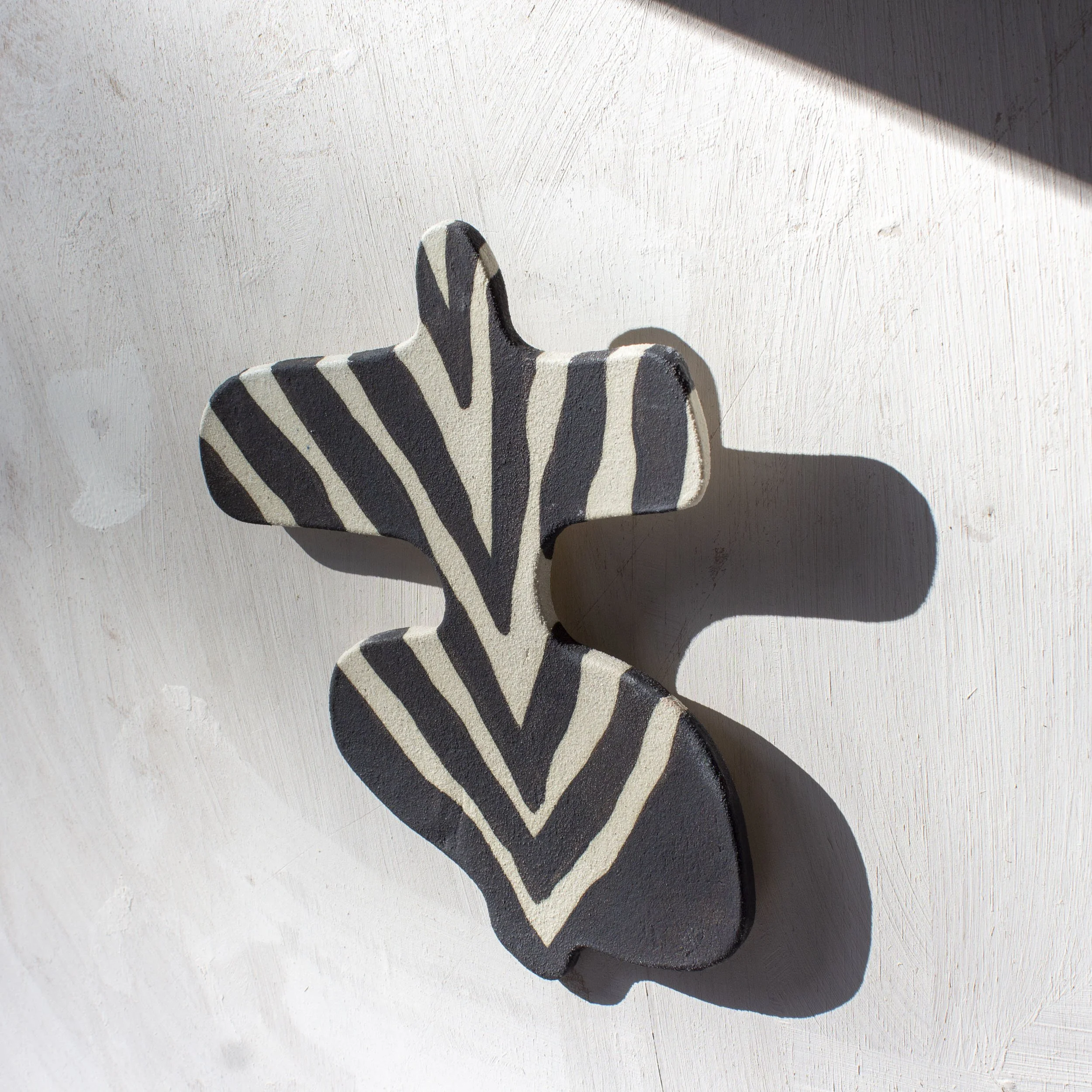 TradeTheMark_Ceramic_Wallpiece_GoingBackwards_Black_2.jpg