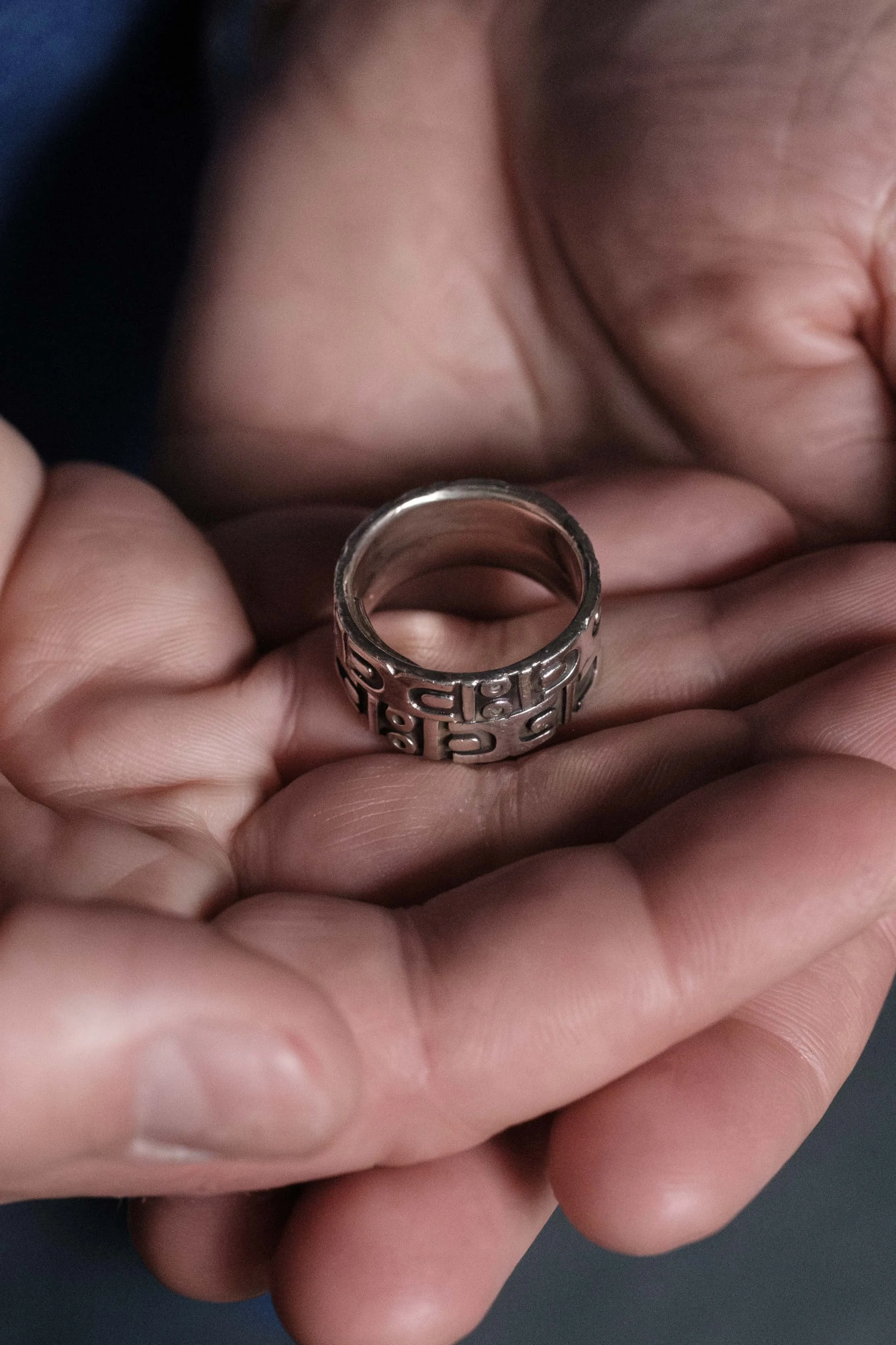 Obergefell and Arthur’s silver wedding rings were fused together after Arthur died. A small square of gold glints inside the band, covering an inlaid trace of his ashes. |