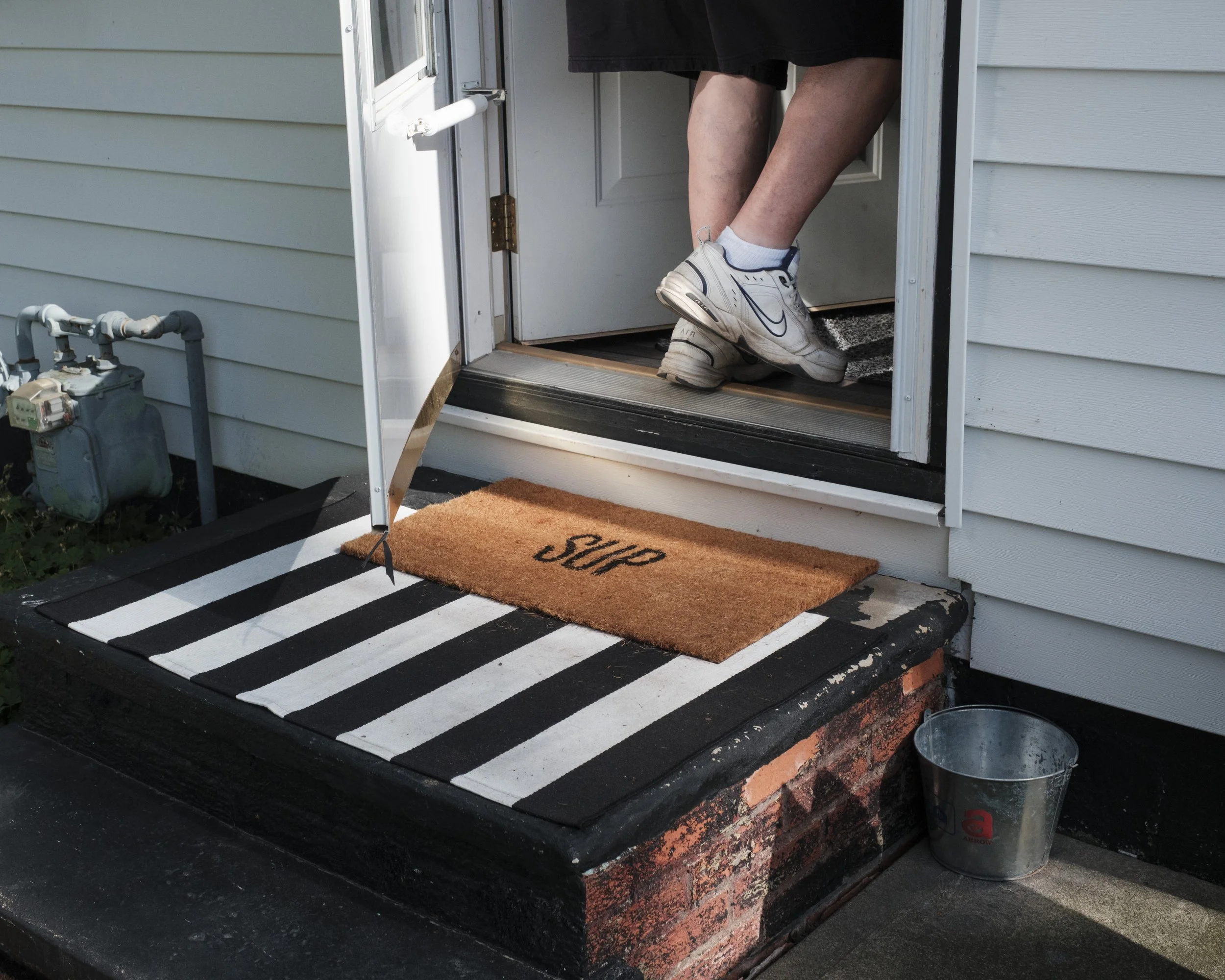 Klima's doormat is emblazoned with his signature catchphrase. 