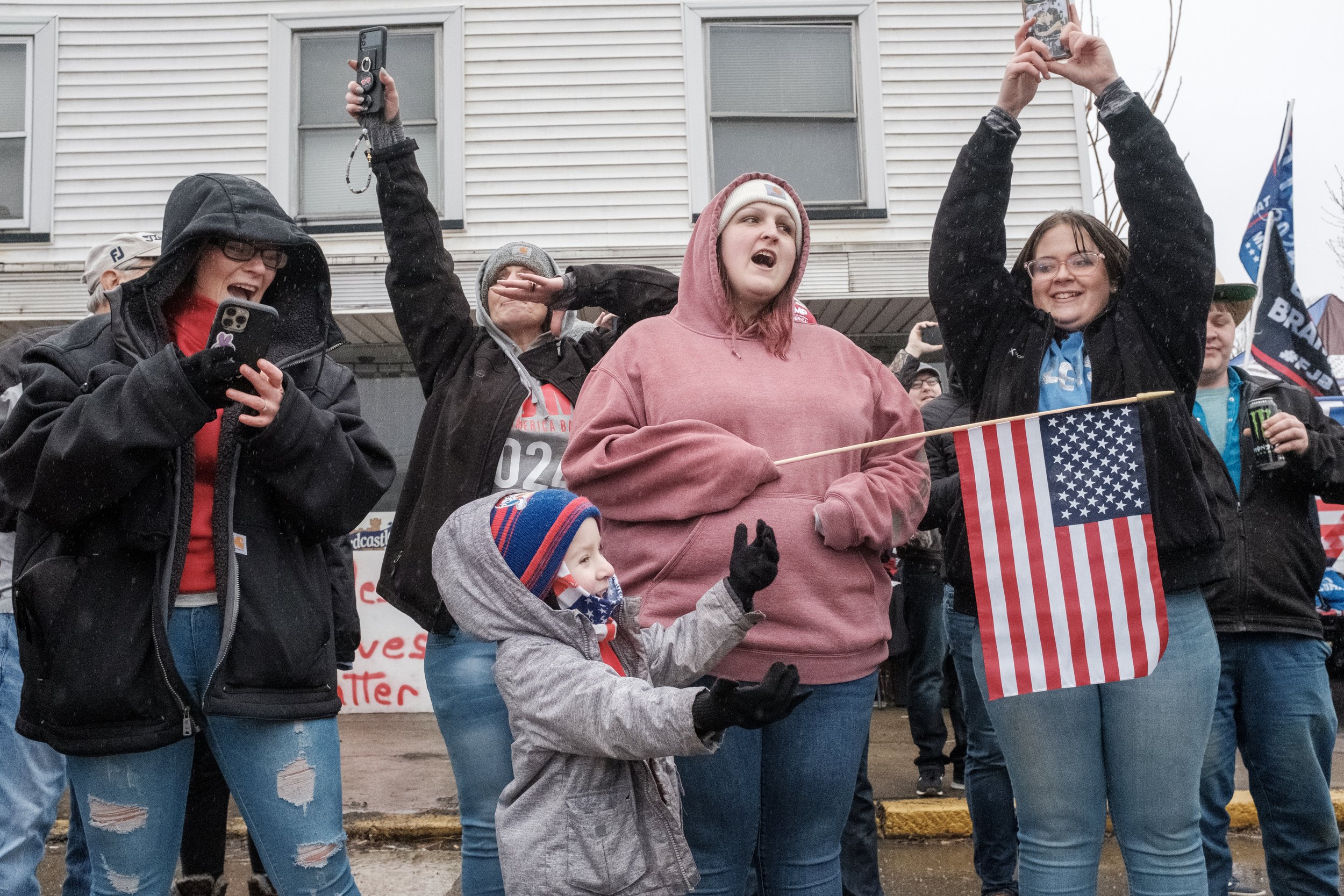 Supporters of Donald Trump cheer for his motorcade during the former president's visit to East Palestine on Feb. 22, 2023.