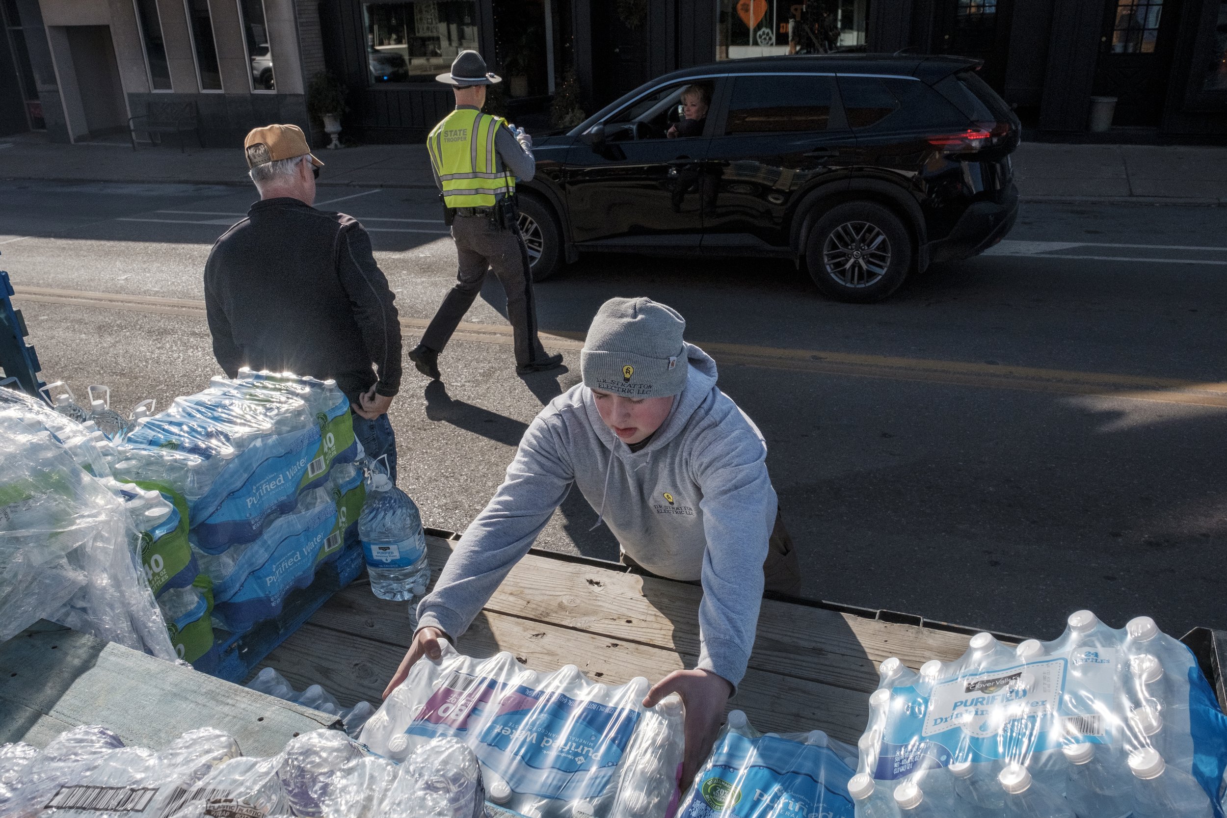 Volunteers distribute bottled water on Market Street in East Palestine.