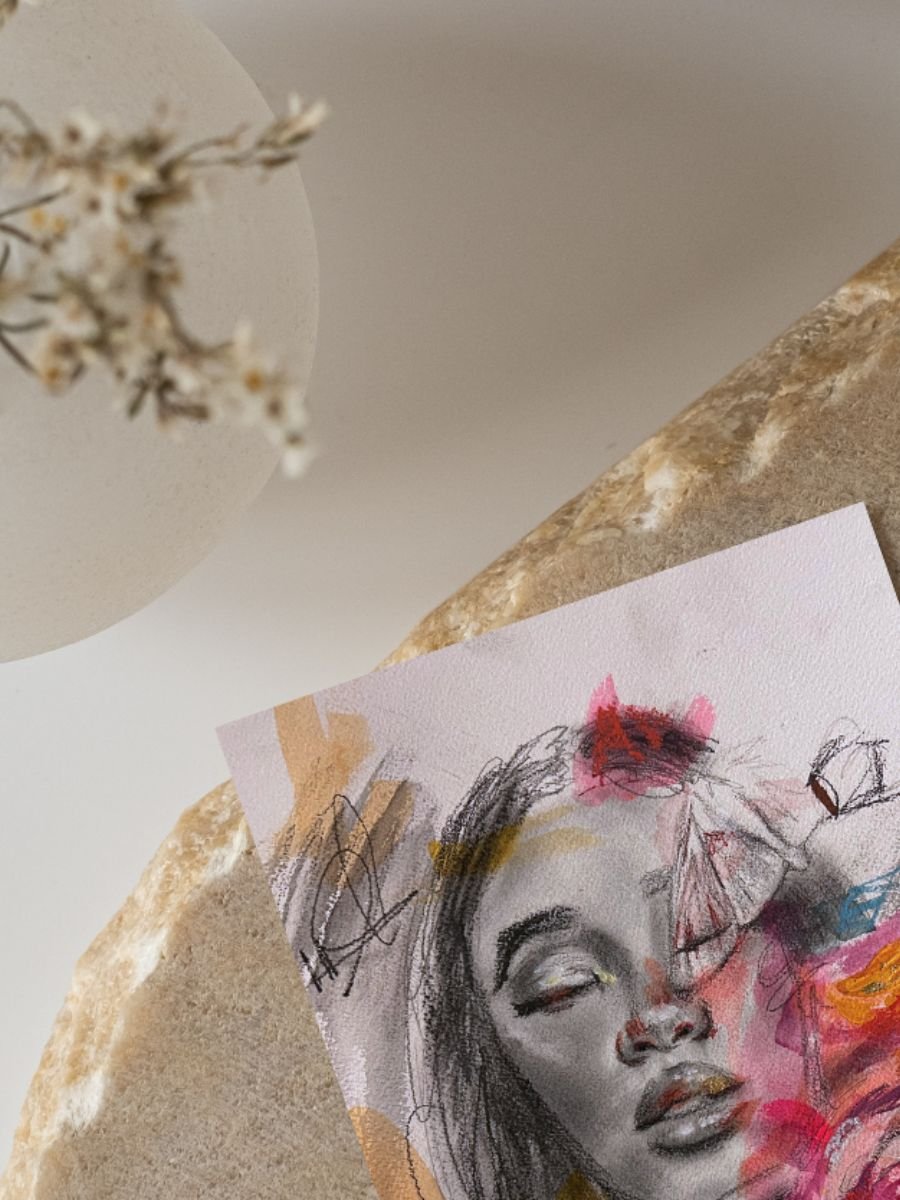 Graphite portrait sketch with colorful elements of a woman with a relaxed expression