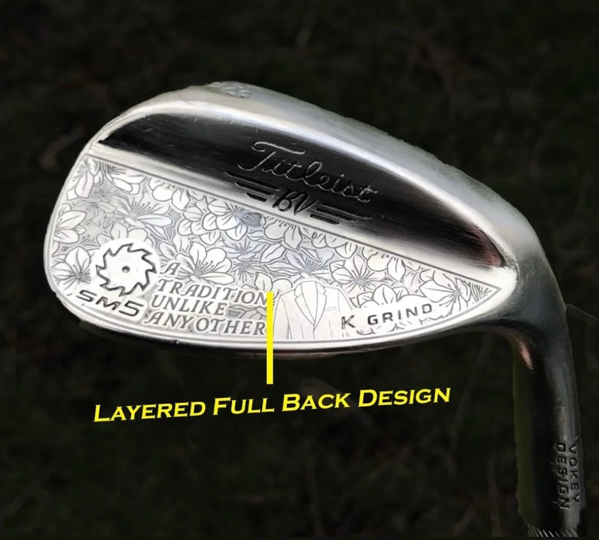 Close-up of a Titleist golf club with intricate floral design and engraved text "SM5" and "K Grind."
