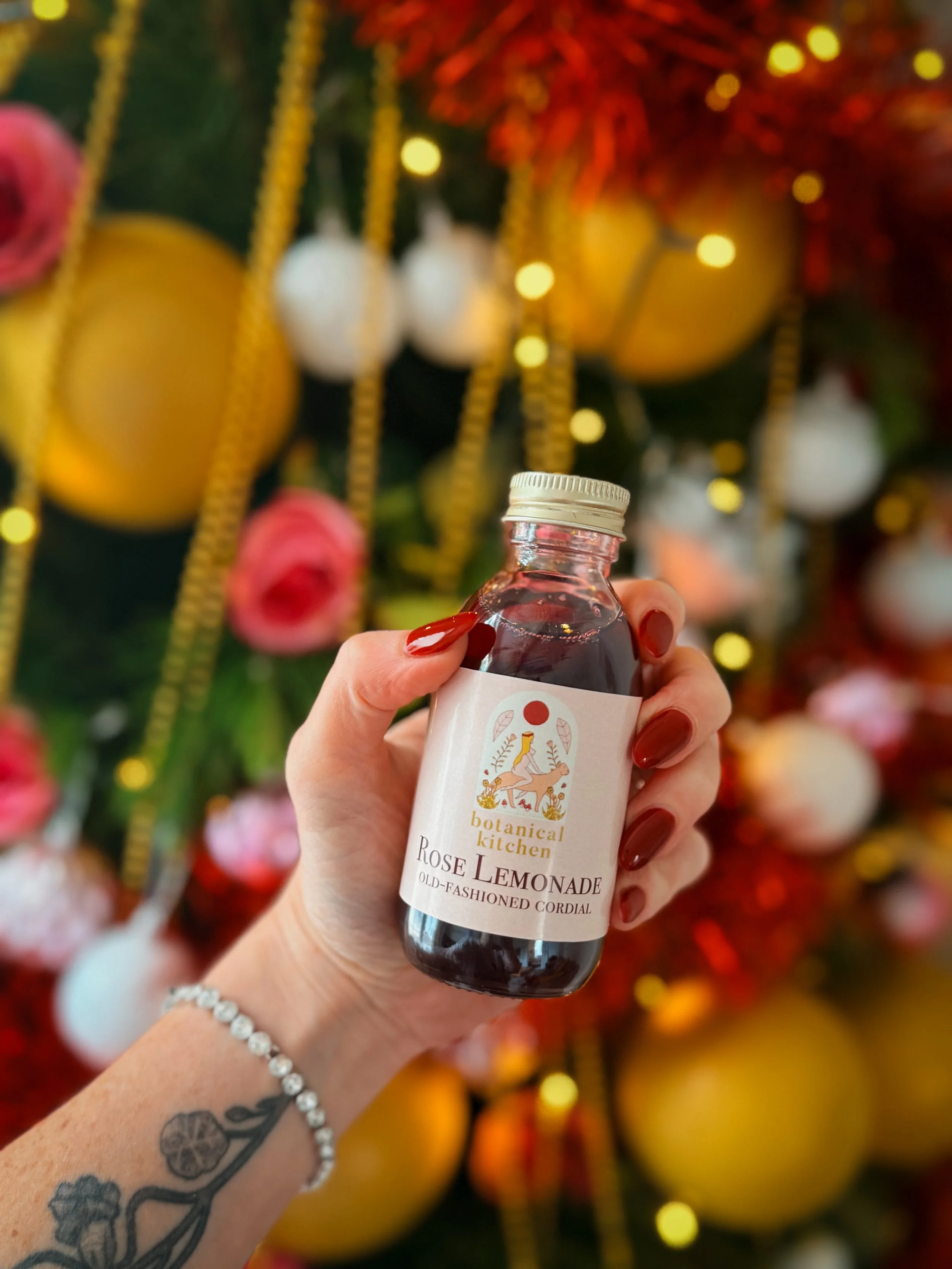 Artisan rose lemonade featuring wild rose petals, fresh citrus and a soft blush colour