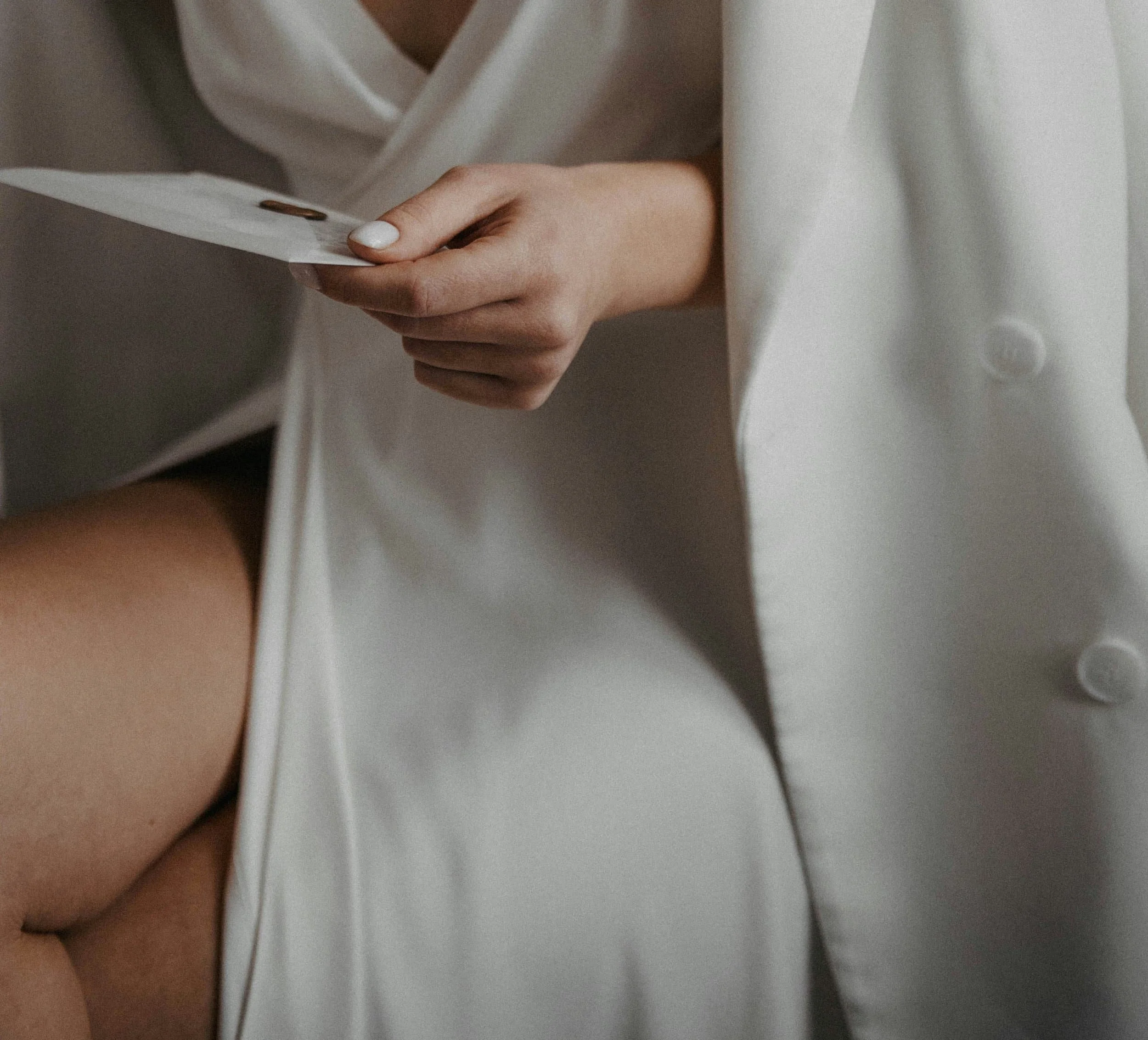 A bride holding an invitation