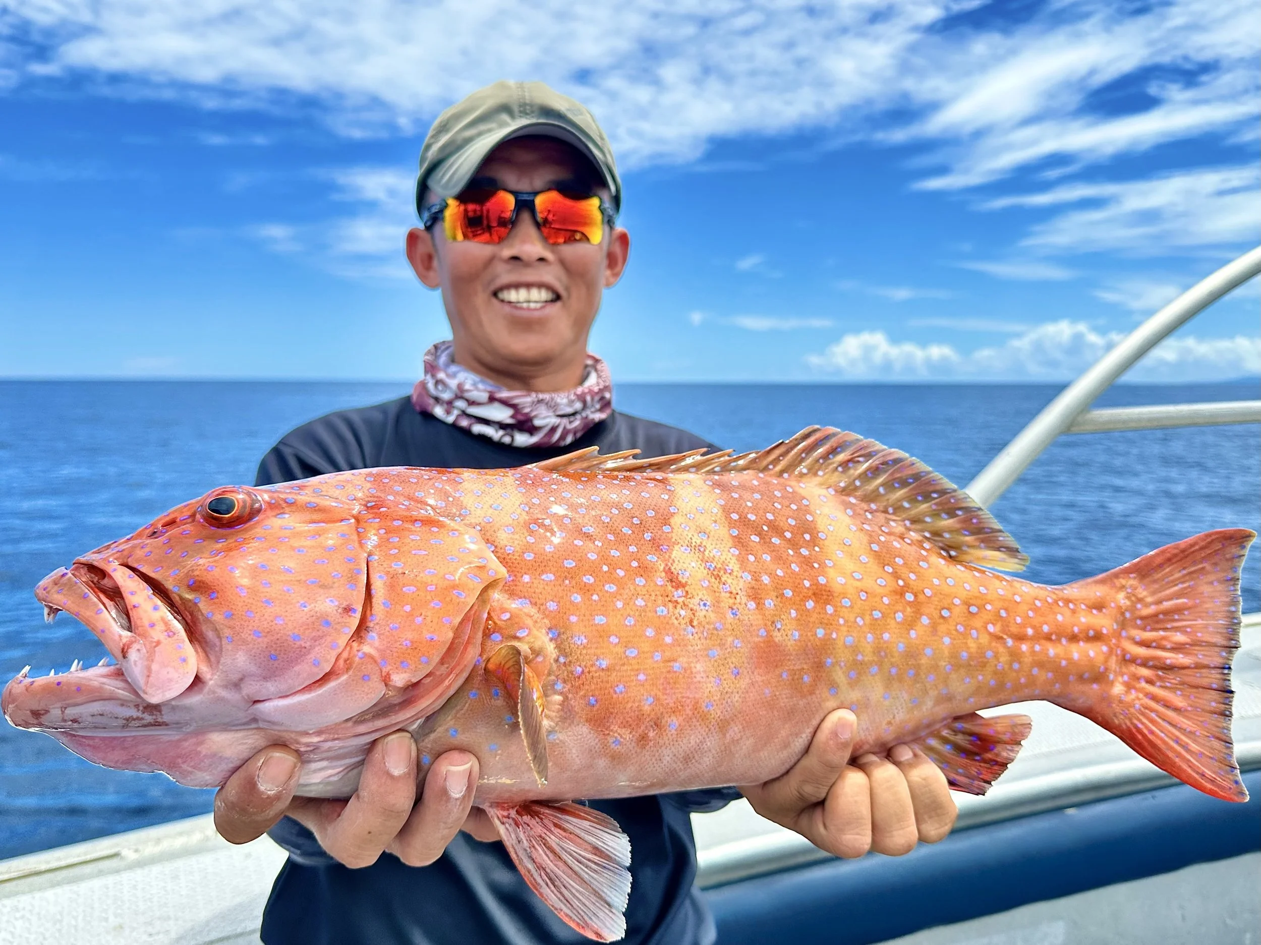 Boris with a fat bluespot coral trout.