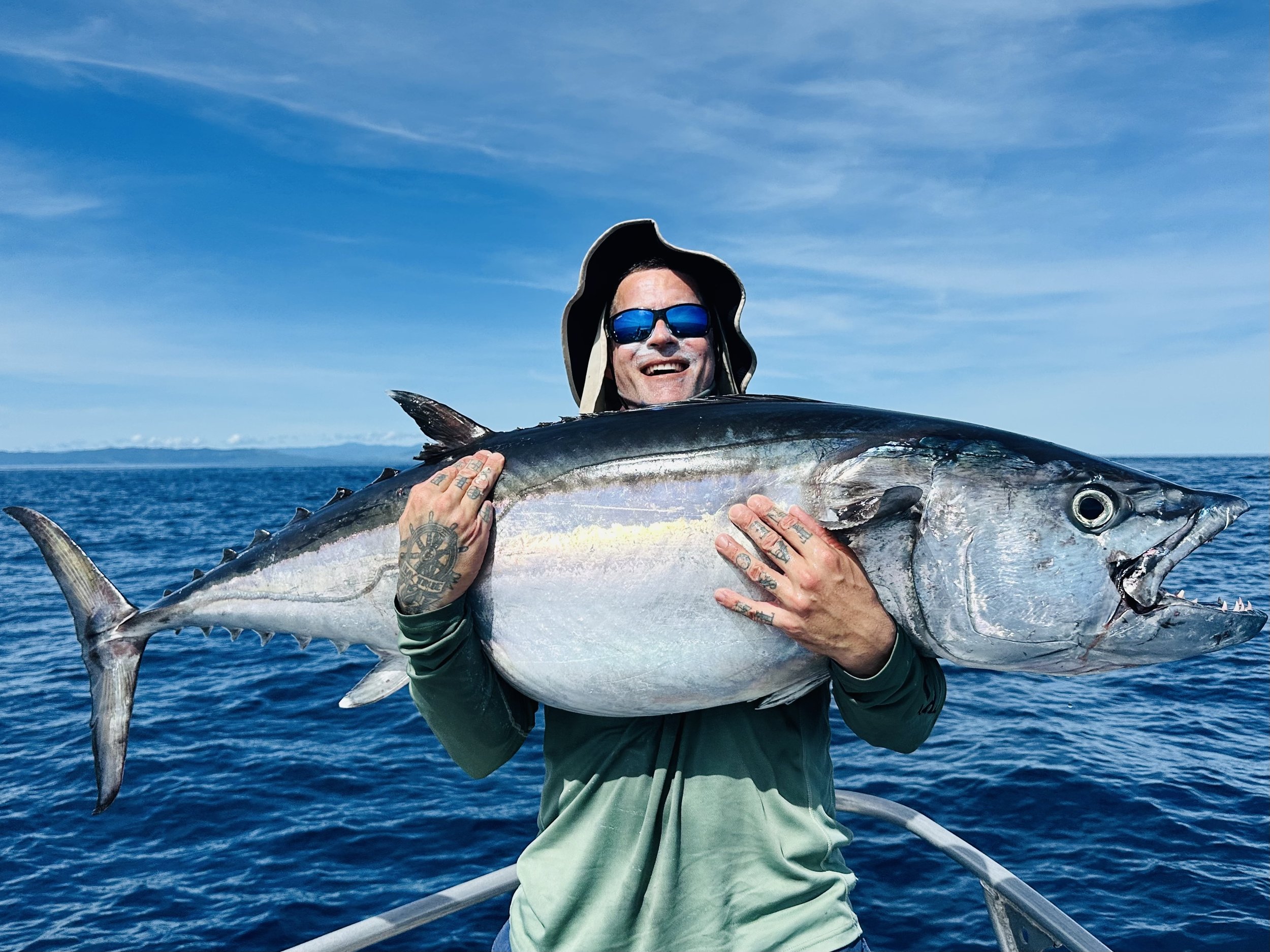 Ryno hugs his giant 150cm dogtooth tuna.