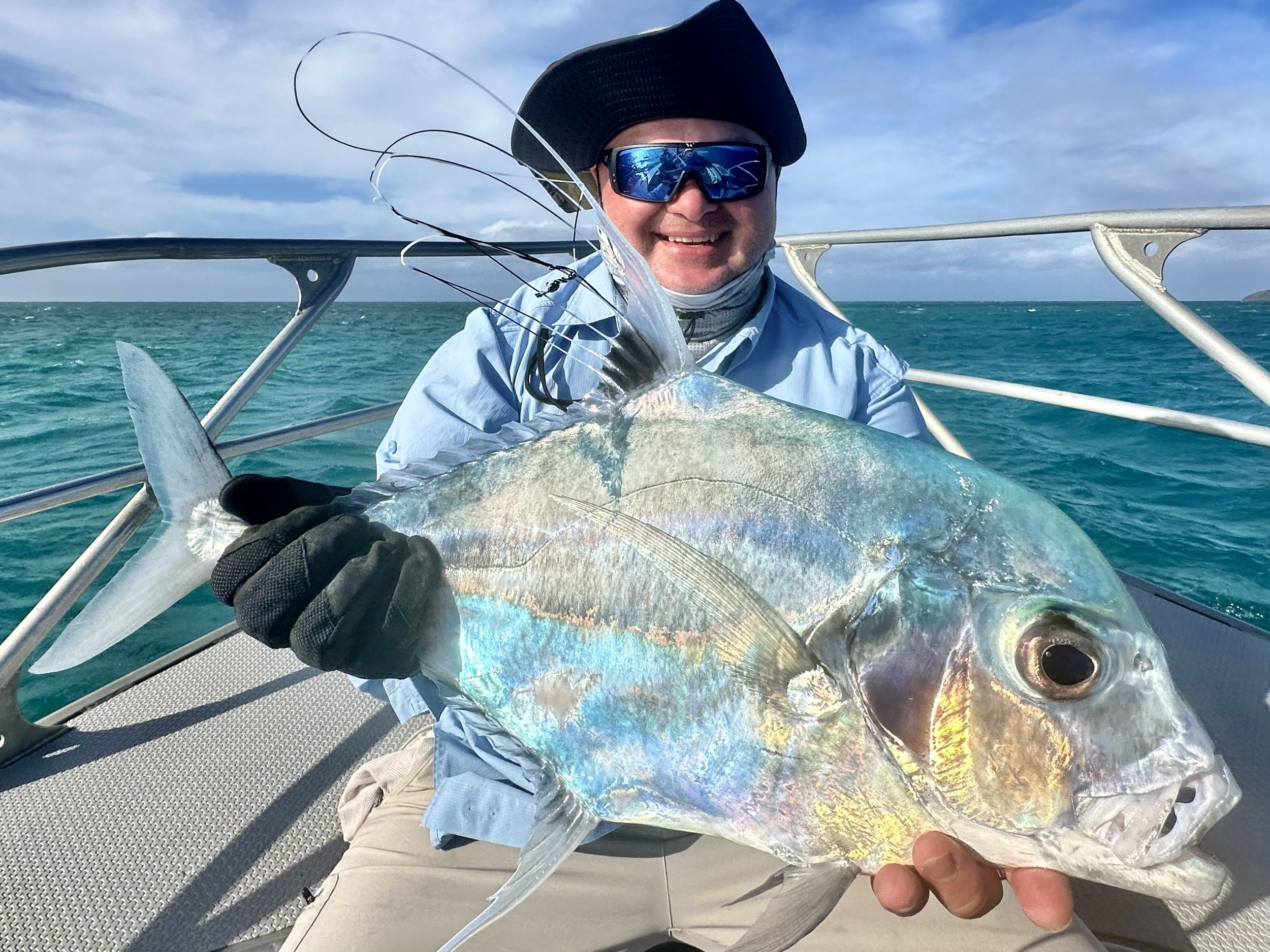Fred with a pennantfish on a windy afternoon.