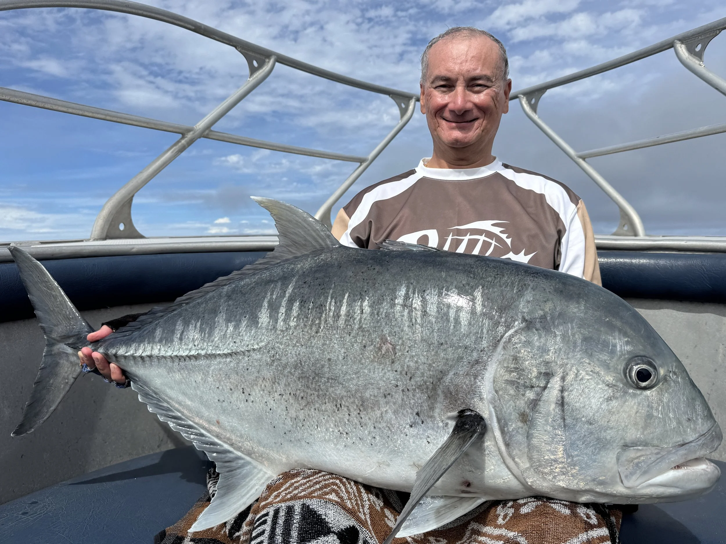 Mike with a proper giant trevally.