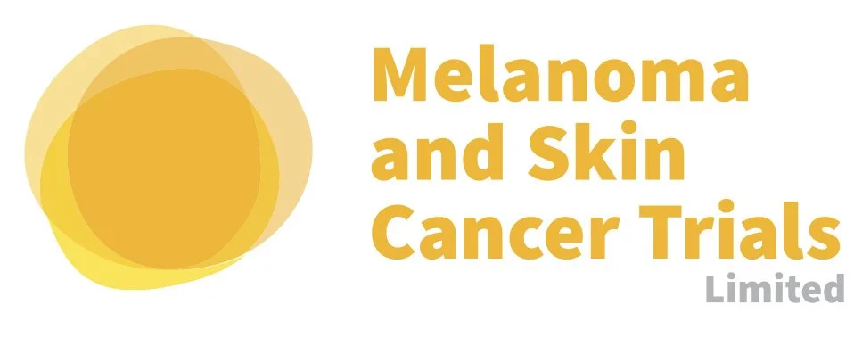 Logo for Melanoma and Skin Cancer Trials Limited featuring overlapping circles in shades of yellow and orange, with bold yellow and gray text.