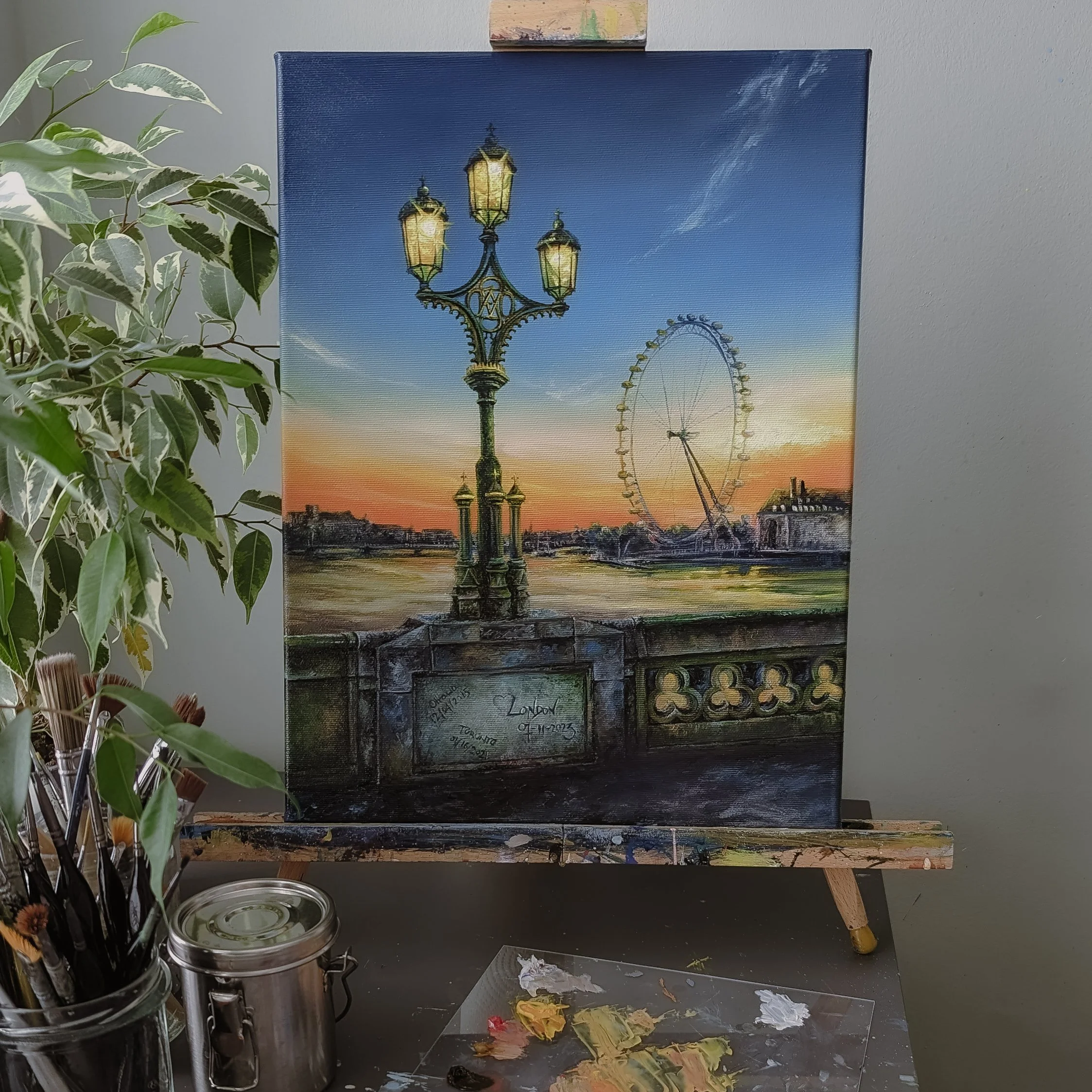 Painting of a London scene featuring a vintage streetlamp, the London Eye Ferris wheel, and a sunset over the Thames River.
