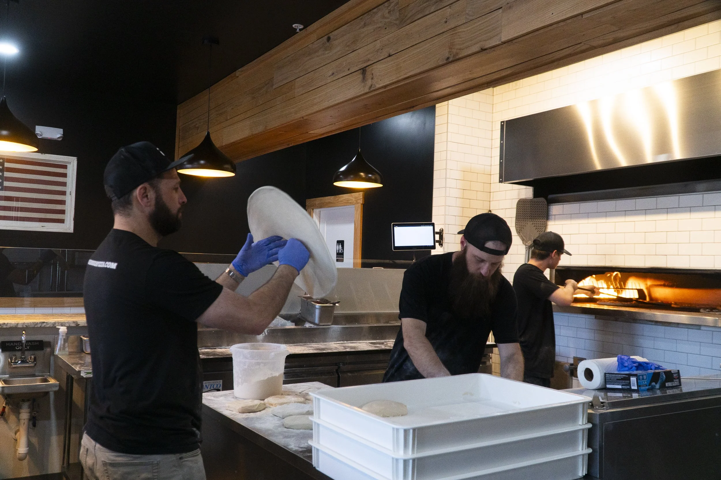 Sourdough pizza company employees making pizza