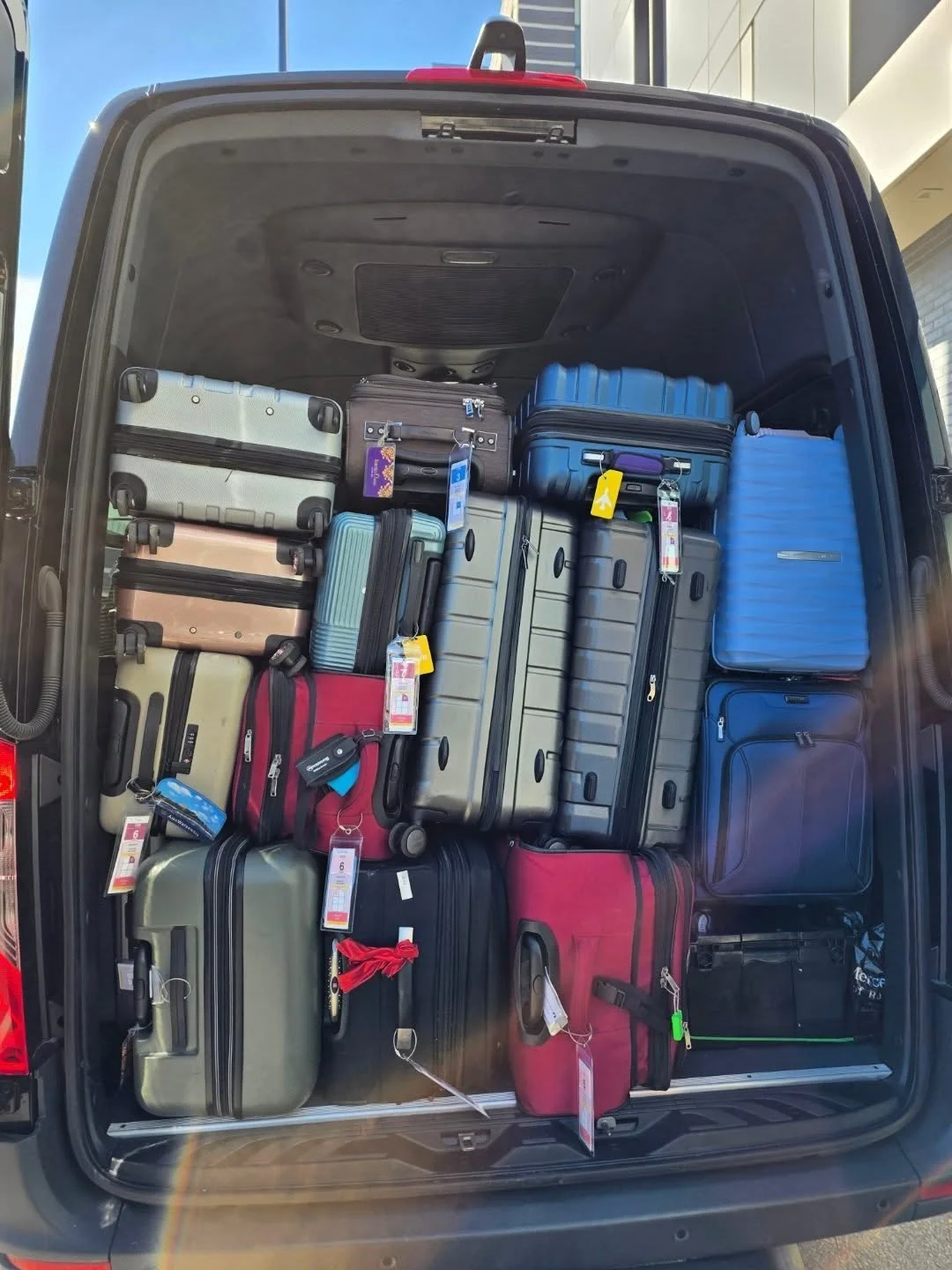Cargo Management Level: EXPERT. 🤩 We challenge you to a game of real-life Tetris! Our driver managed to fit a staggering 16 suitcases in the back of the shuttle. That's a whole lot of vacation packed and ready to go for this group of 23 going on a c