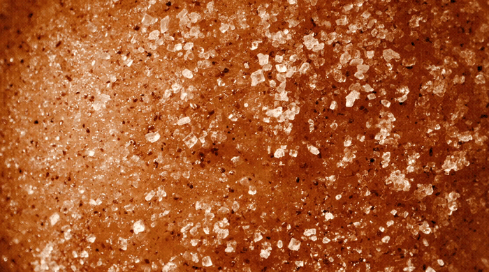 a close up of a brown background with white speckles.gif