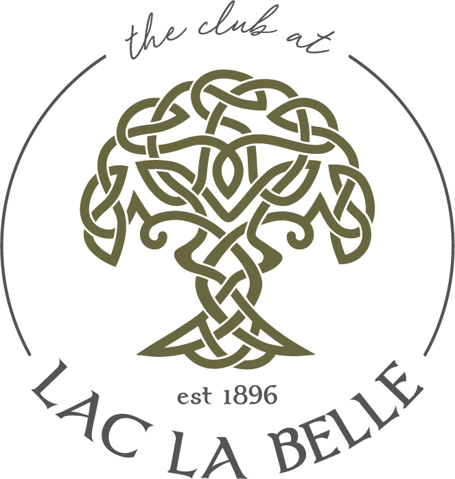 Logo with a stylized tree made of intertwining lines, surrounded by text 'the club at' above, 'est 1896' below, and 'LAC LA BELLE' circled around the bottom.