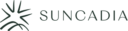 Logo of Suncadia with a stylized sun and mountains design.