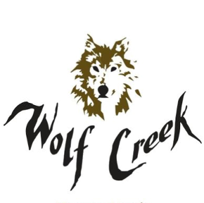 Illustration of a wolf's head with a green eye, above the text 'Wolf Creek' in stylized font.