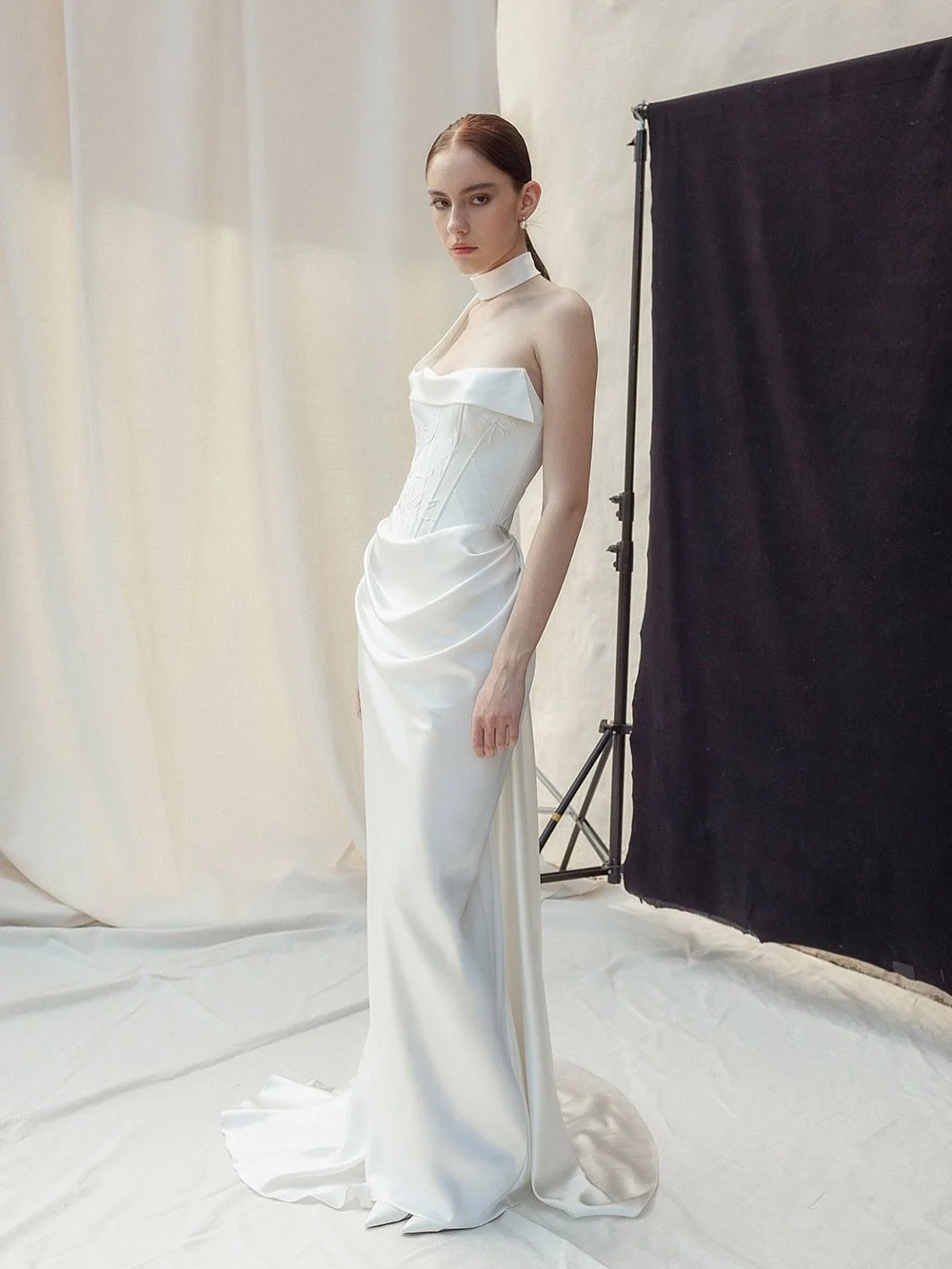 Introducing Eva &mdash; the latest from Divine Atelier.

@divineatelier is known for marrying fine tailoring with poetic details. Hand-painted florals, precise boning, and unexpected touches. Eva&rsquo;s detachable neck scarf lets you customise the l