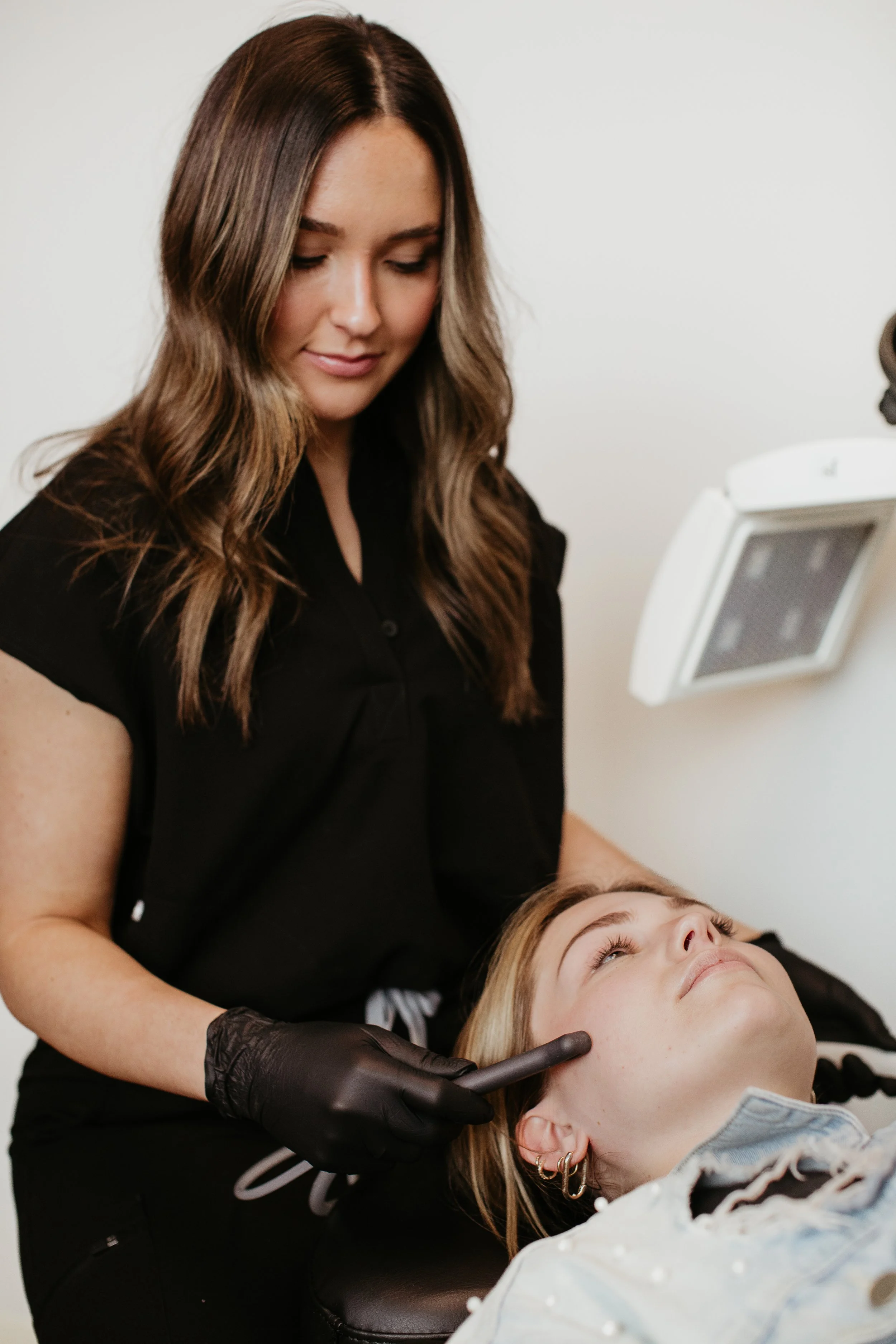 Provider preparing a SaltFacial skin treatment for a patient at Sona Medical Aesthetics Newcastle WA