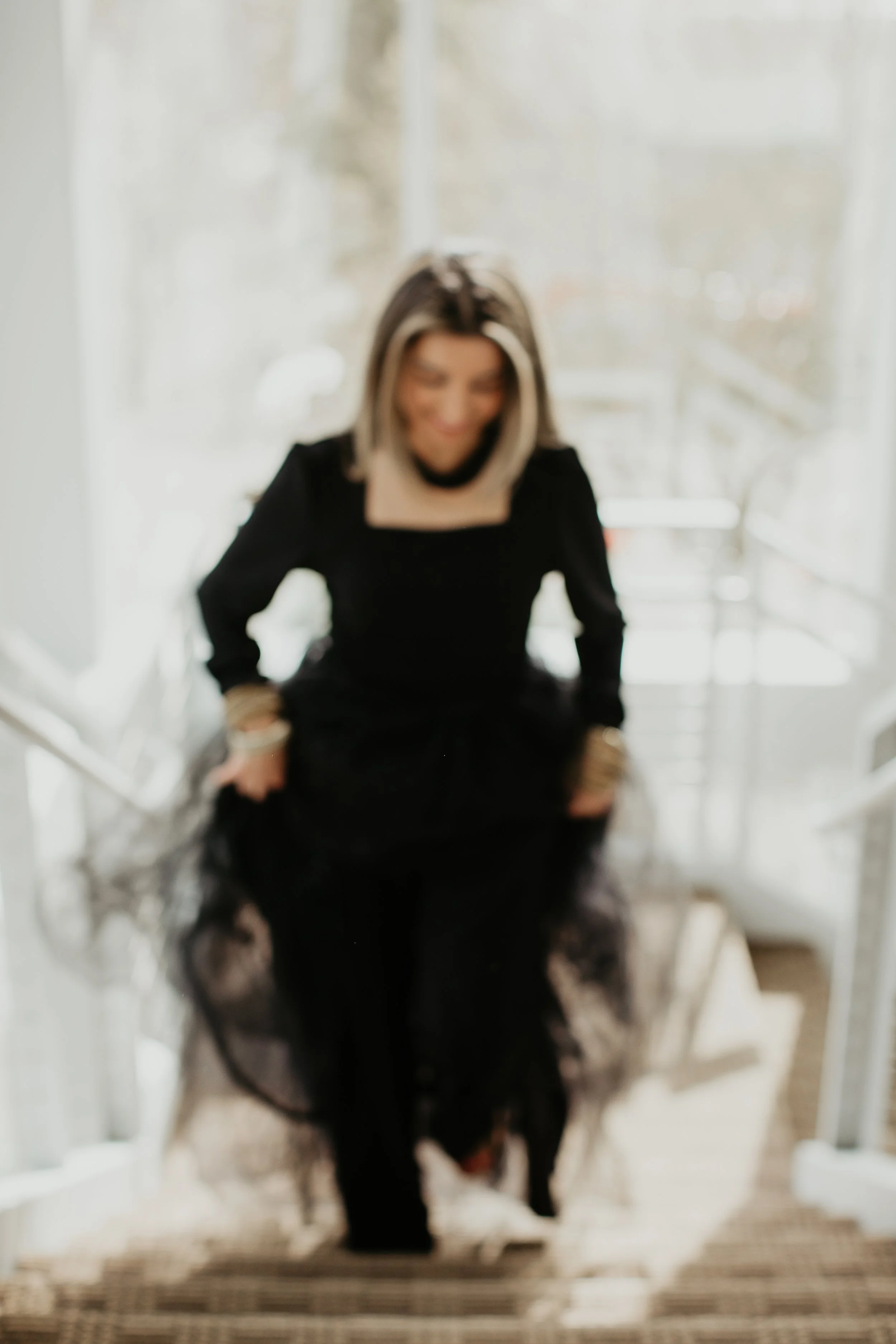Simi, provider at Sona Medical Aesthetics med spa in Newcastle WA wearing a dramatic black tulle dress