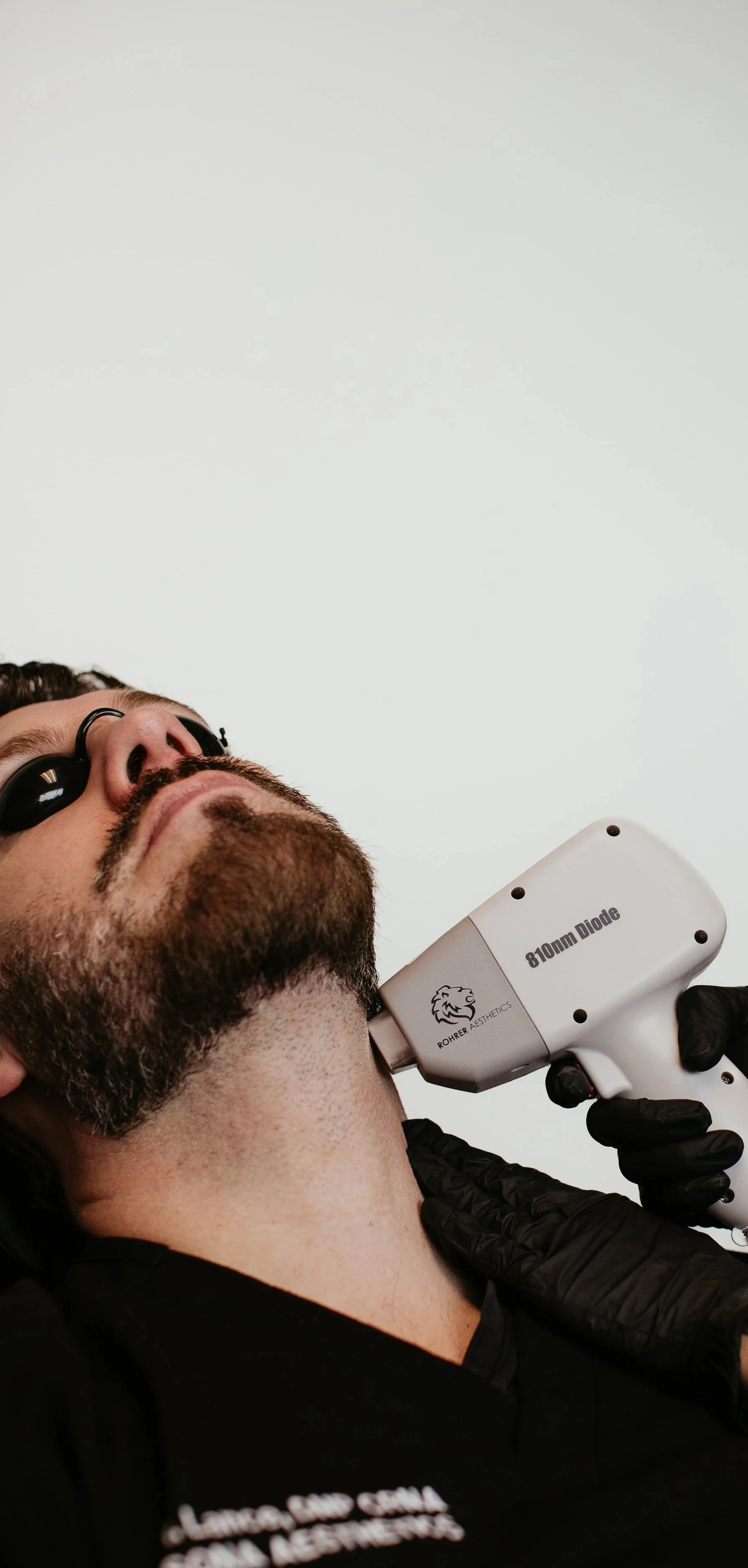 Provider conducting a laser skin consultation at Sona Medical Aesthetics med spa Newcastle WA