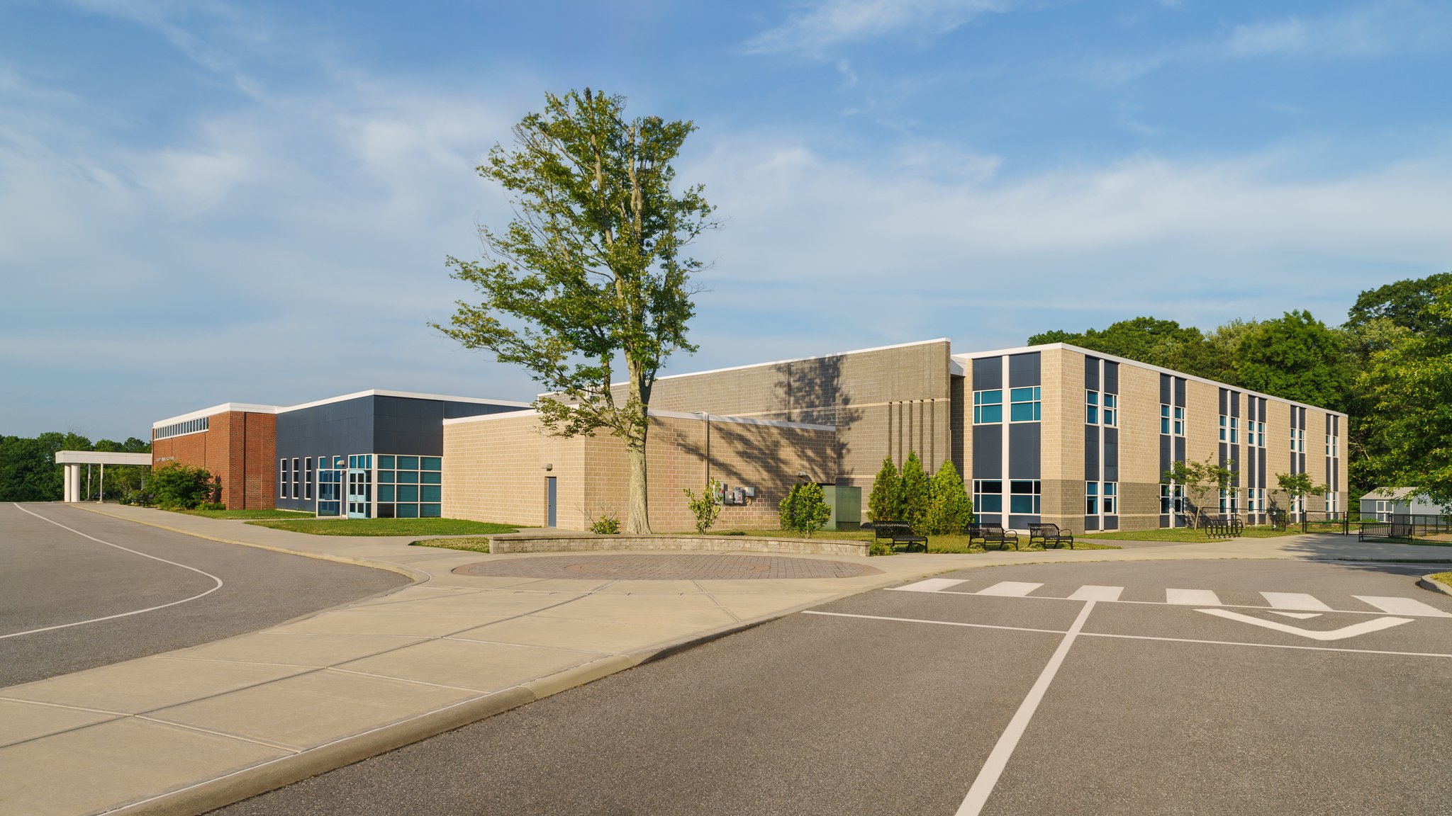 Bus lanes curving toward the school entrances.